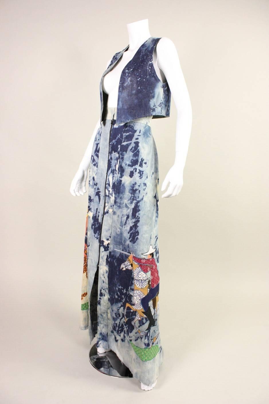 Vintage ensemble from Serendipity 3 is made of acid-washed denim and features an amazing appliqued cowboy/Indian scene.  Vest is reversible with no closures and a pocket.  Maxi skirt has a zippered front and is unlined.  This item is extremely rare