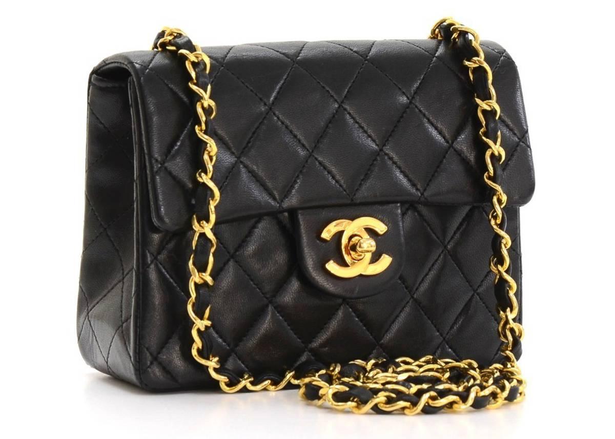 This ladies Chanel Mini Flap Bag is primarily made from black lambskin leather complimented by gold hardware. This bag is in excellent pre-owned condition accompanied by Authenticity card. Circa 1989. Our  reference is HB164 should you need to quote