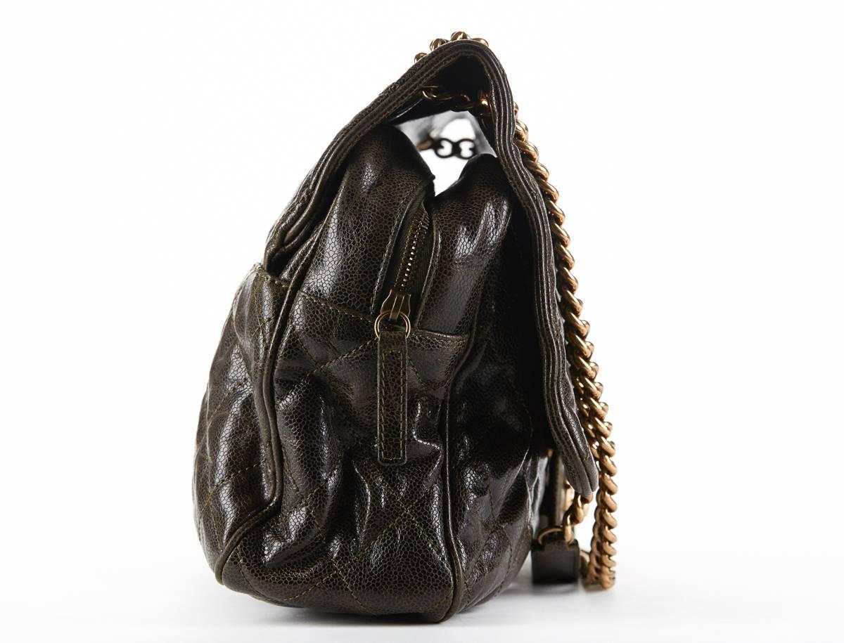 This ladies Chanel Maxi Shiva Flap Bag is primarily made from khaki crumpled grained calfskin complimented by gold hardware. This bag is in very good pre-owned condition. Circa 2012. Our  reference is HB181 should you need to quote