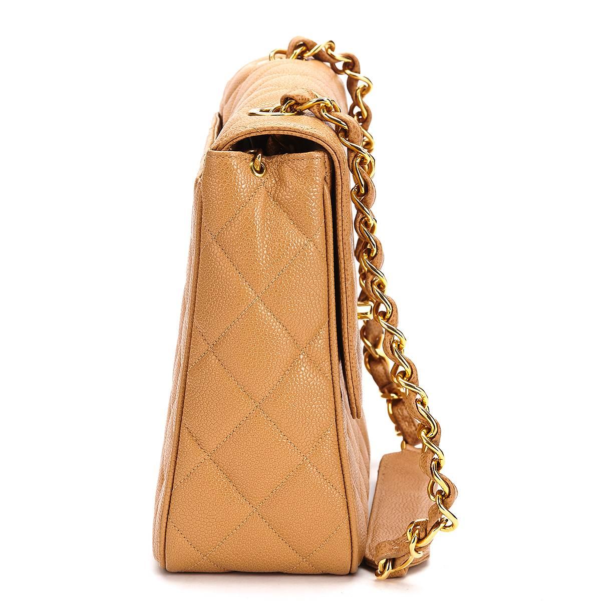 CHANEL
Tan Quilted Caviar Leather Vintage Single Flap Bag

This CHANEL Single Flap Bag is in Very Good Pre-Owned Condition accompanied by Chanel Dust Bag. Circa 1994. Primarily made from Caviar Leather complimented by Gold hardware. Our 