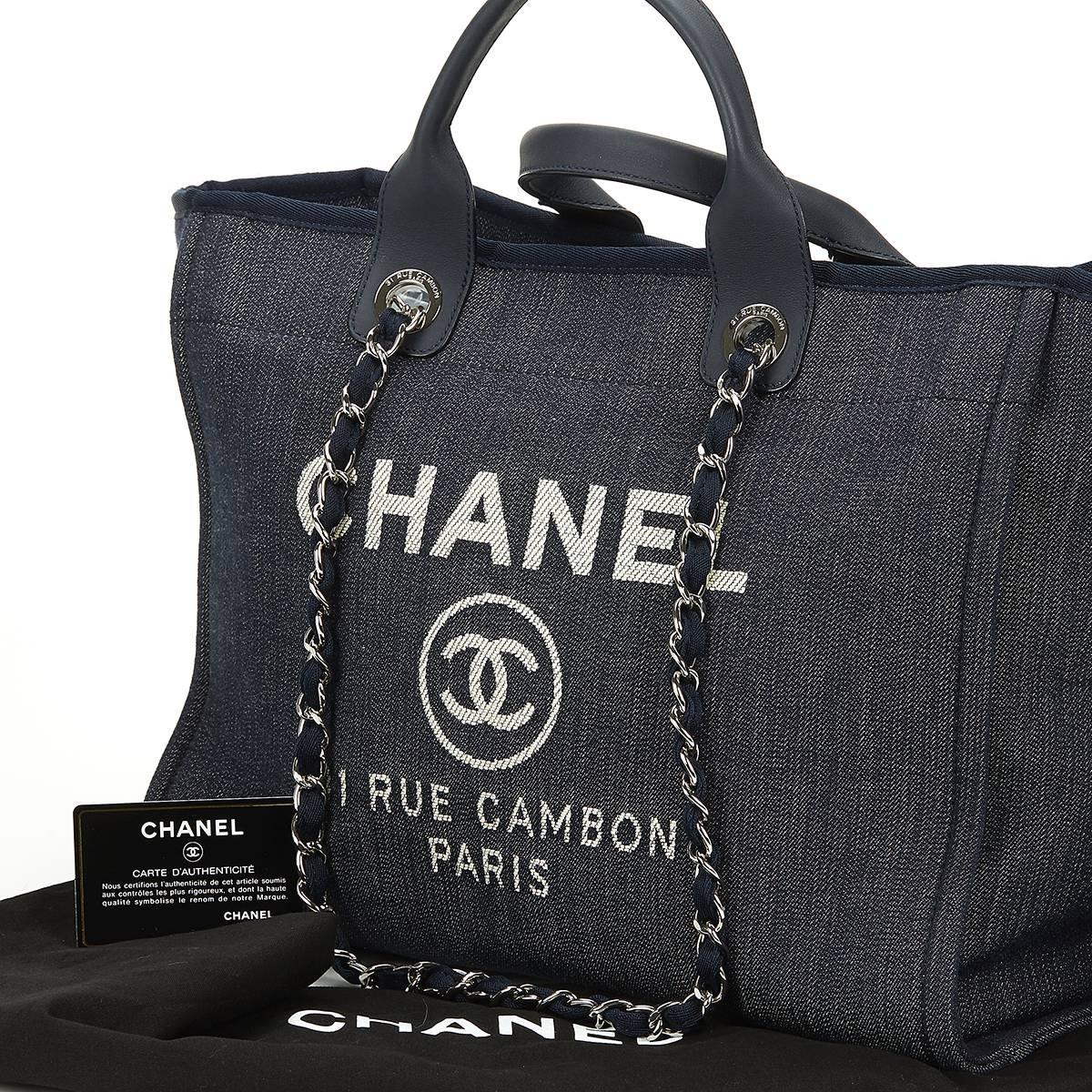 CHANEL
Navy Canvas Large Deauville Tote

This CHANEL Large Deauville Tote is in Excellent Pre-Owned Condition accompanied by Chanel Dust Bag, Authenticity Card. Circa 2014. Primarily made from Canvas complimented by Silver hardware. Our 