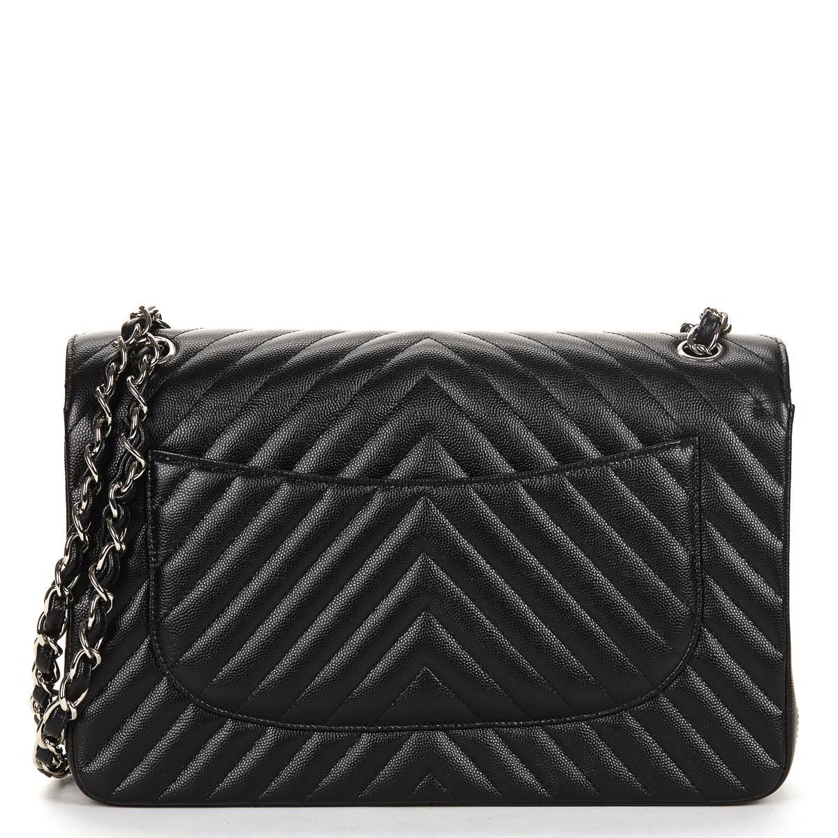 CHANEL
BLACK CHEVRON QUILTED CAVIAR LEATHER JUMBO CLASSIC DOUBLE FLAP BAG 2016

This ladies Chanel Jumbo Classic Double Flap Bag is primarily made from black caviar leather complimented by silver hardware. This bag is in unworn condition