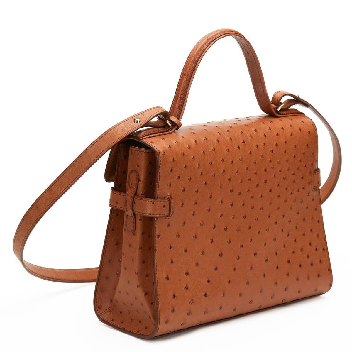 Delvaux
TAN OSTRICH LEATHER TEMPETE MM 2000'S

This ladies Delvaux Tempete MM is primarily made from tan ostrich leather complimented by gold hardware. This bag is in excellent pre-owned condition accompanied by Shoulder strap, compact mirror.