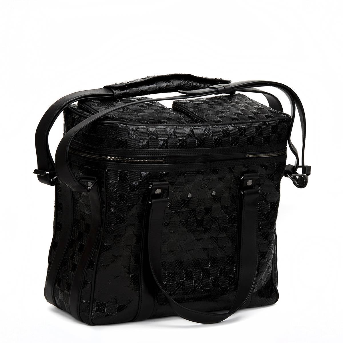 LOUIS VUITTON
Black Damier Python DJ Bag

 Reference: CB102
Serial Number: FO0068
Age (Circa): 2008
Authenticity Details: Serial Stamp (Made in Italy)
Gender: Unisex
Type: Travel, Shoulder, Tote, Business

Colour: Black
Hardware: Silver
Material(s):