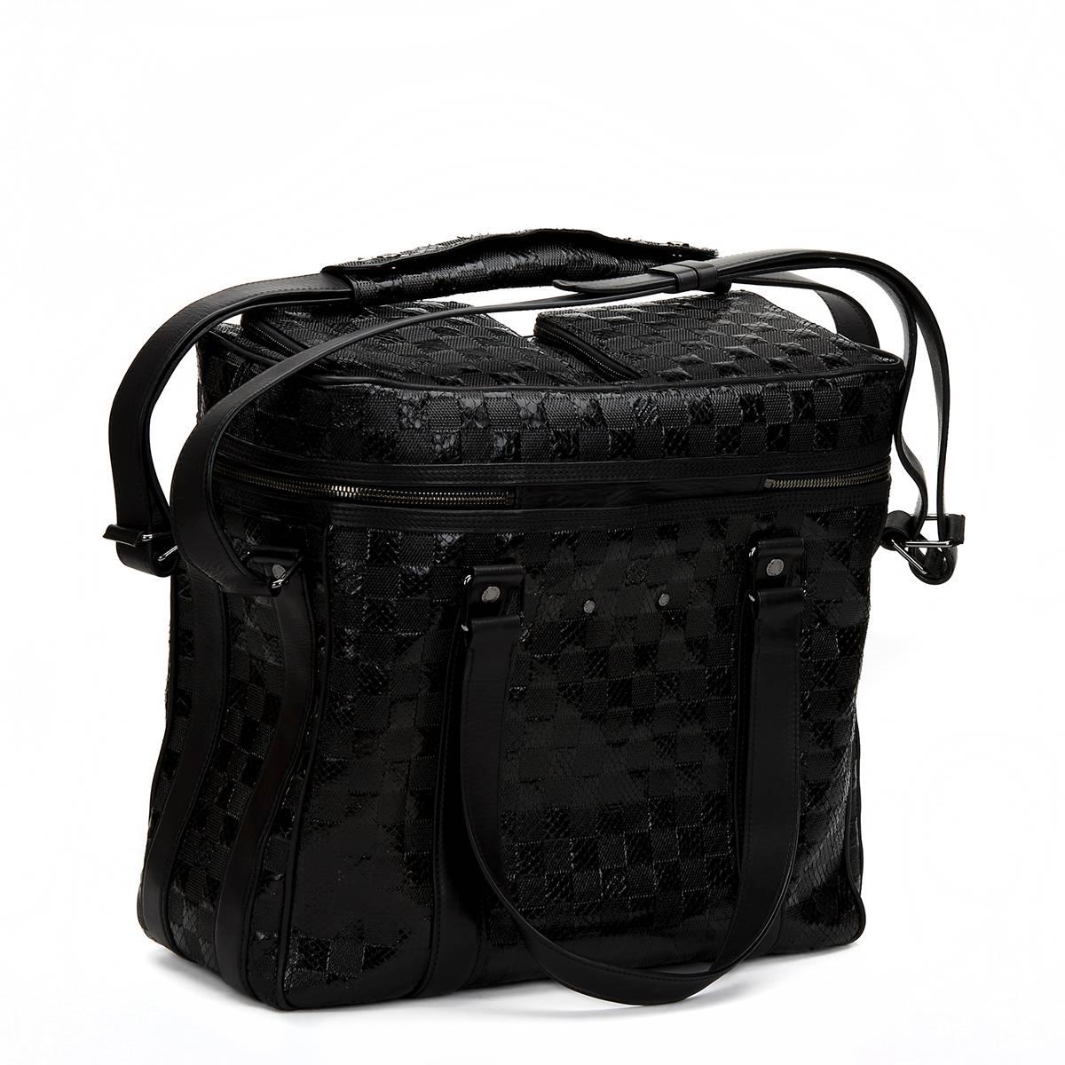 Louis Vuitton
Black Damier Python DJ Bag 2008

This unisex Louis Vuitton DJ Bag is primarily made from black python complimented by silver hardware. This bag is in very good pre-owned condition. Circa 2008. Our  reference is CB102 should you need