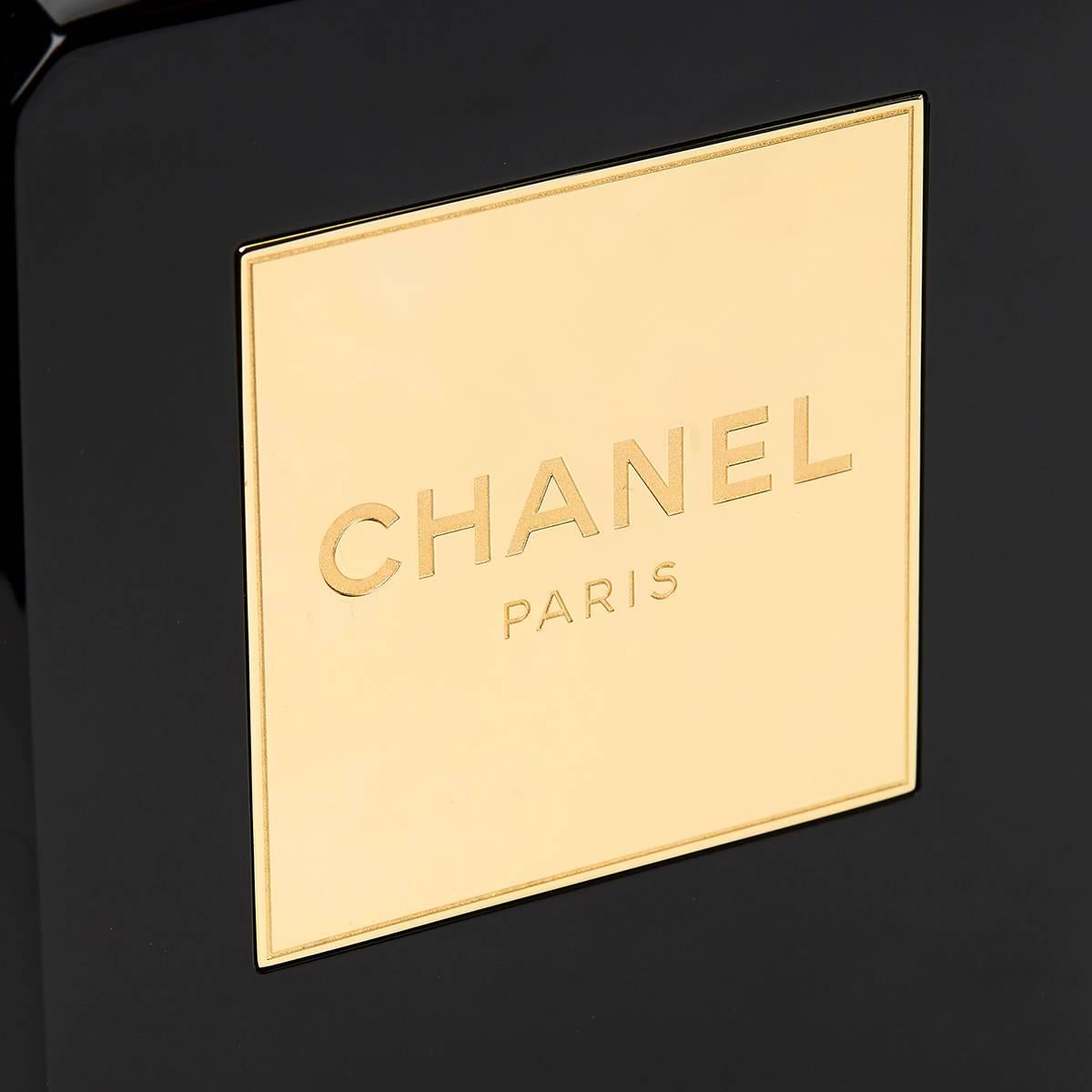 CHANEL
Black Plexiglass No. 5 Perfume Bottle Bag 2014

This ladies Chanel Perfume Bottle Bag is primarily made from black plexiglass complemented by gold hardware. This bag is in excellent pre-owned condition accompanied by Chanel dust bag, box,