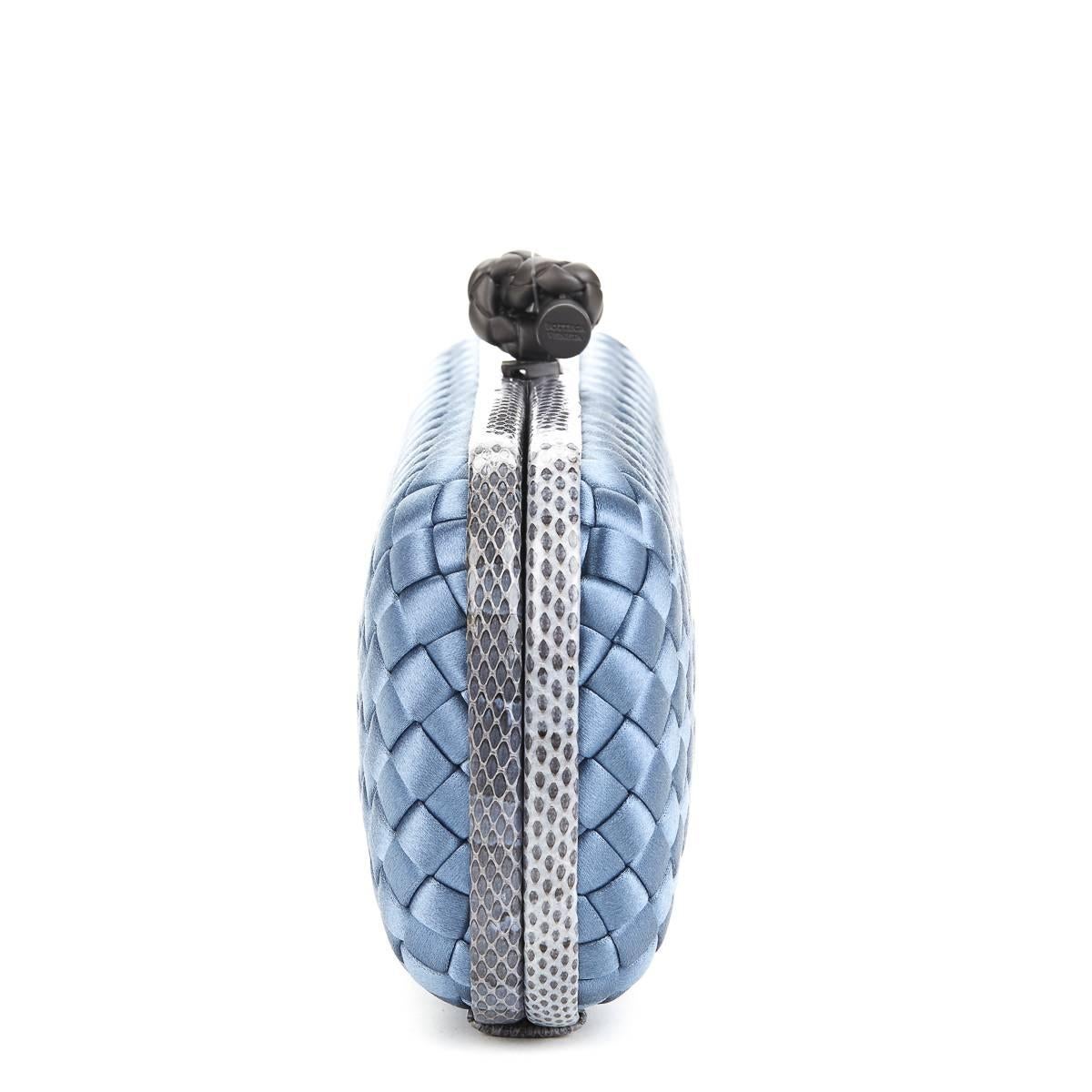 BOTTEGA VENETA
Glaucous Blue Woven Satin & Snakeskin Trim Long Knot Clutch

This BOTTEGA VENETA Long Knot Clutch is in Excellent Pre-Owned Condition accompanied by Care Card. Circa 2000. Primarily made from Satin complimented by Gunmetal