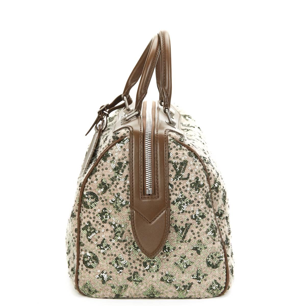 LOUIS VUITTON
Khaki Sequin Sunshine Express Speedy 30

This LOUIS VUITTON Speedy 30 is in Excellent Pre-Owned Condition accompanied by Louis Vuitton Dust Bag, Care Card, Luggage Tag. Circa 2012. Primarily made from Embellishment complimented by
