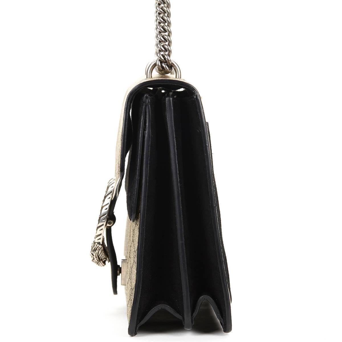 GUCCI
GG Supreme Canvas & Black Suede Medium Dionysus

This GUCCI Medium Dionysus is in Excellent Pre-Owned Condition accompanied by Care Cards. Circa 2016. Primarily made from Coated Canvas complimented by Antiqued SIlver hardware. Our 