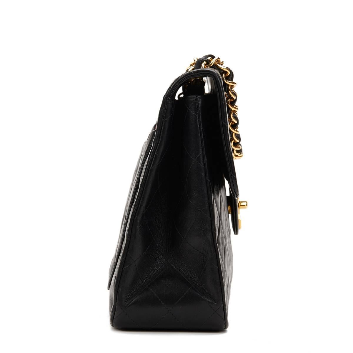 CHANEL
Black Quilted Lambskin Vintage Maxi Jumbo XL Flap Bag

This CHANEL Maxi Jumbo XL Flap Bag is in Very Good Pre-Owned Condition. Circa 1994. Primarily made from Lambskin Leather complimented by Gold hardware. Our  reference is HB907 should you