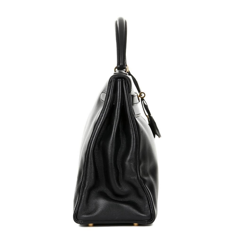 "HERMÈS
Black Evergrain Leather Vintage Kelly 35cm Retourne

This HERMÈS Kelly 35cm is in Excellent Pre-Owned Condition accompanied by Hermes Dust Bag, Lock, Keys, Clochette, Shoulder Strap. Circa 1997. Primarily made from Evergrain Leather