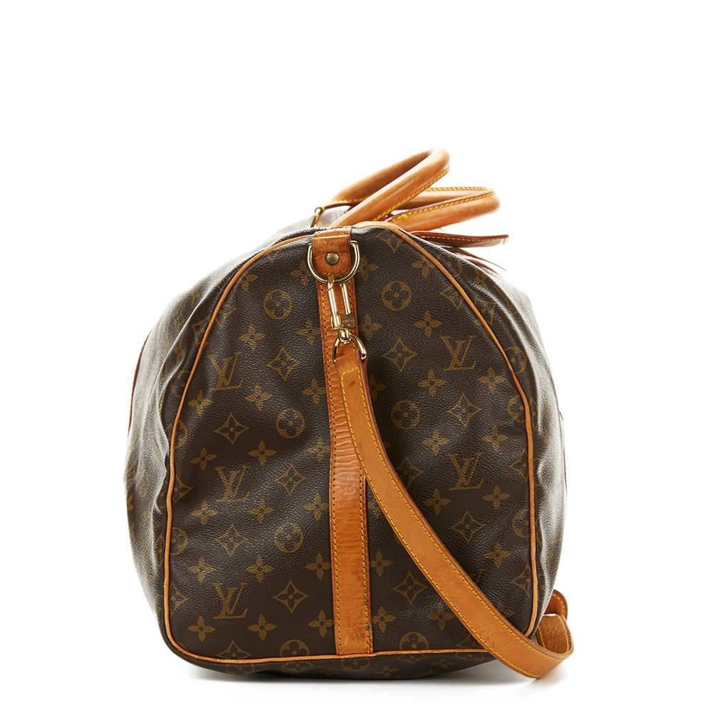 LOUIS VUITTON
Brown Coated Monogram Canvas Vintage Keepall Bandouliere 55

This LOUIS VUITTON Keepall Bandouliere 55 is in Excellent Pre-Owned Condition accompanied by Luggage Tag, Shoulder Strap, Padlock (1 Key). Circa 1992. Primarily made from
