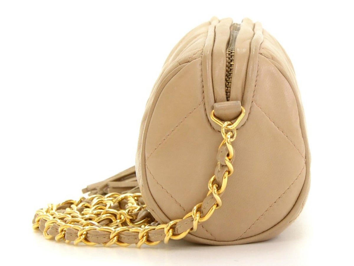 Women's 1990s Chanel Tan Quilted Leather Mini CC Logo Shoulder Fringe Tassel Bag