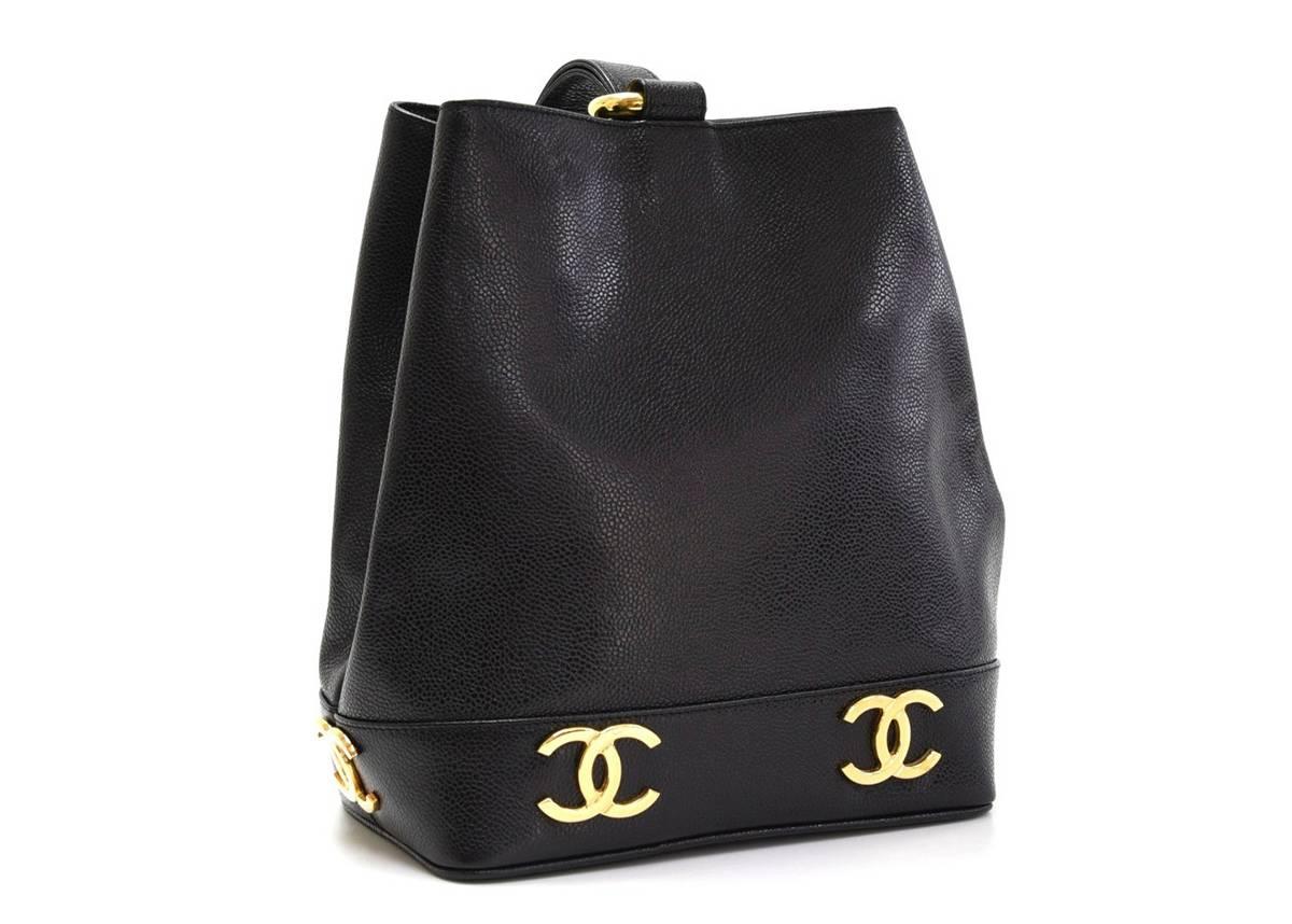 This ladies Chanel Bucket Bag is in excellent pre-owned condition accompanied by Chanel dust bag, authenticity card. Circa 1994. Primarily made from Caviar Leather complimented by Gold hardware. Our  reference is HB085 should you need to quote