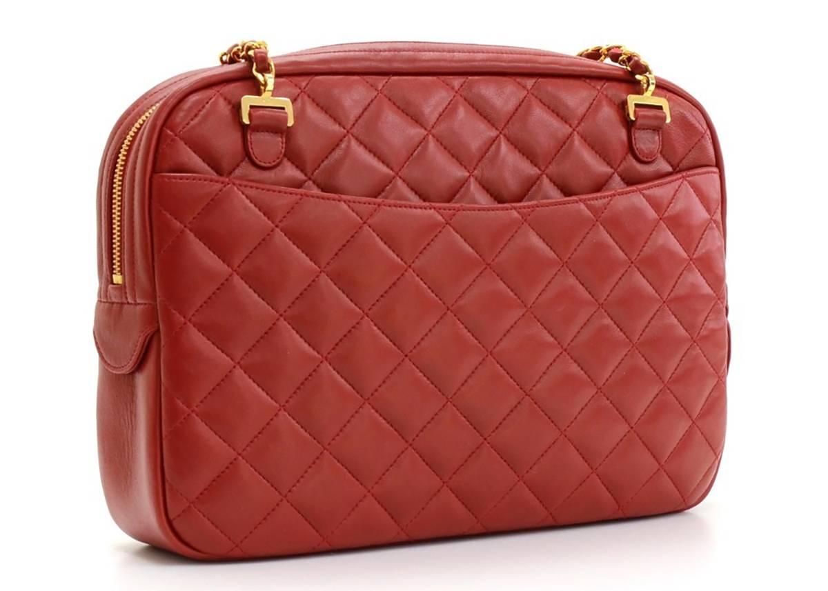 This ladies Chanel Timeless Shoulder Bag is primarily made from red lambskin leather complimented by gold hardware. This bag is in excellent pre-owned condition accompanied by Chanel dust bag. Circa 1991. Our  reference is HB128 should you need to