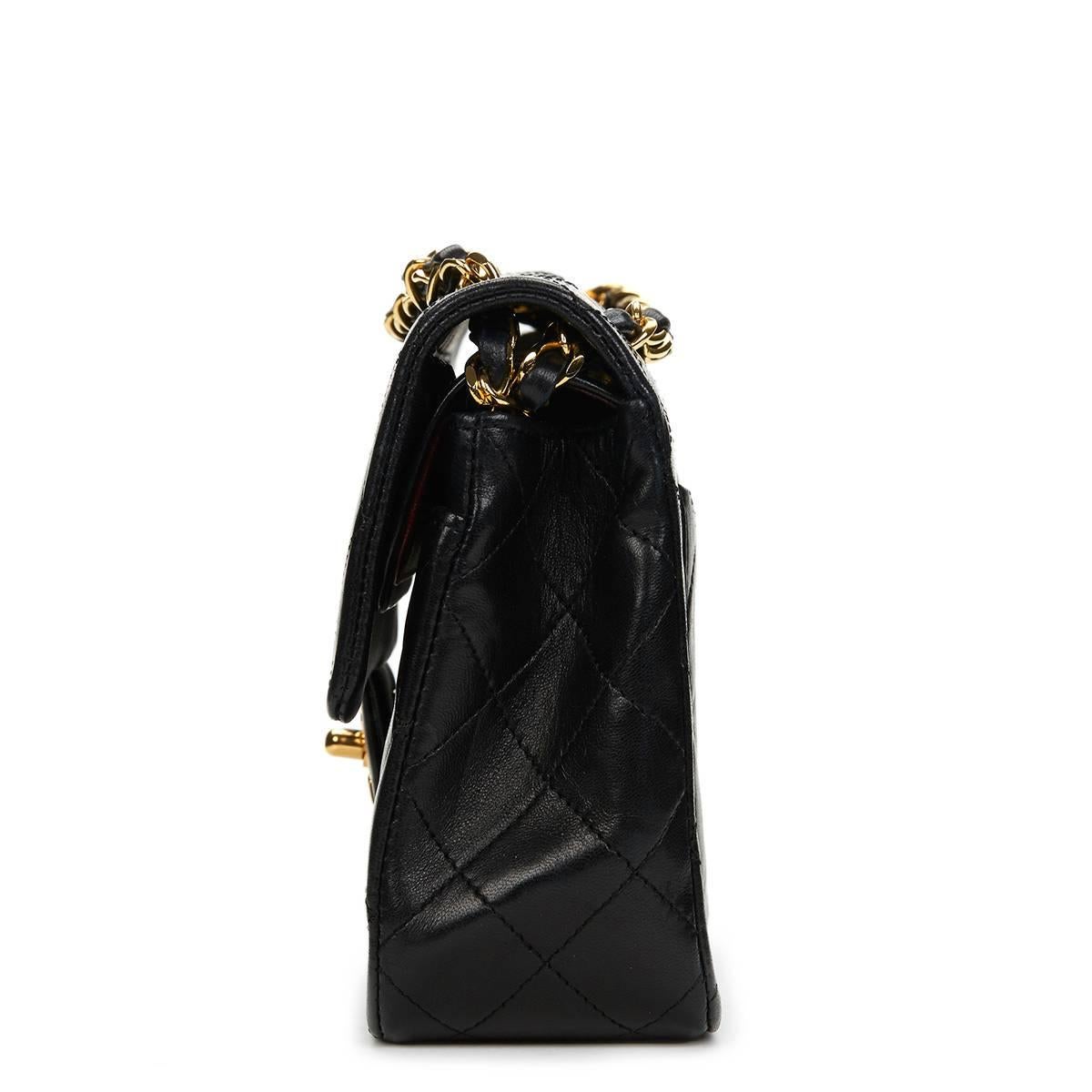 CHANEL
Black Quilted Lambskin Vintage Small Classic Double Flap Bag

This CHANEL Small Classic Double Flap Bag is in Excellent Pre-Owned Condition. Circa 1989. Primarily made from Lambskin Leather complimented by Gold hardware. Our  reference is