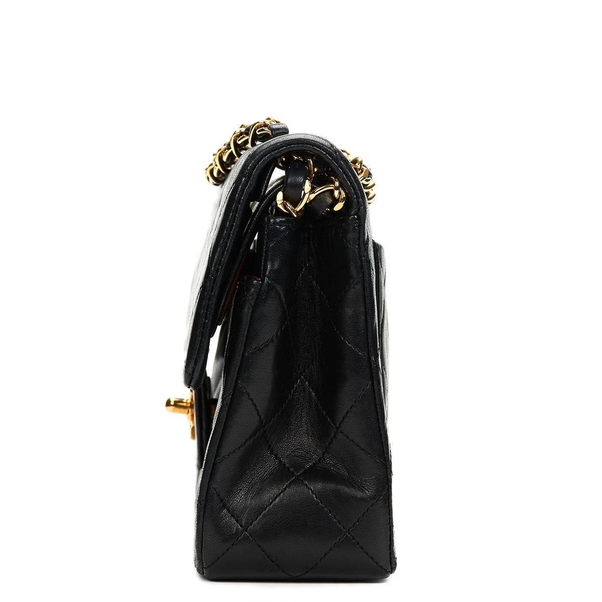 CHANEL
Black Quilted Lambskin Vintage Small Classic Double Flap Bag

This CHANEL Small Classic Double Flap Bag is in Very Good Pre-Owned Condition. Circa 1991. Primarily made from Lambskin Leather complimented by Gold hardware. Our  reference is