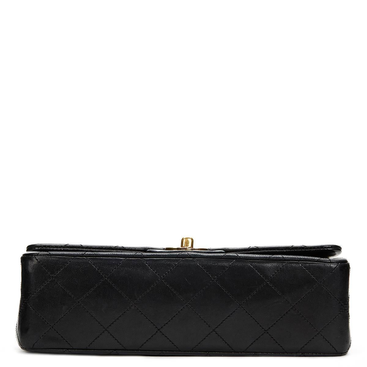 CHANEL
Black Quilted Lambskin Vintage Small Classic Double Flap Bag

This CHANEL Small Classic Double Flap Bag is in Very Good Pre-Owned Condition accompanied by Authenticity Card. Circa 1987. Primarily made from Lambskin Leather complimented by