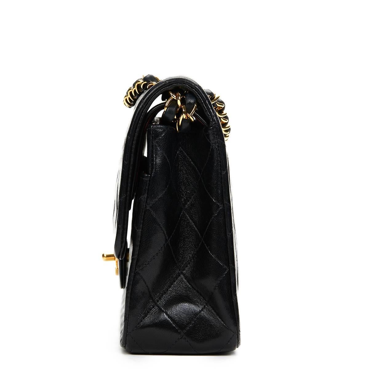 CHANEL
Black Quilted Lambskin Vintage Medium Classic Double Flap Bag

This CHANEL Medium Classic Double Flap Bag is in Very Good Pre-Owned Condition accompanied by Chanel Box. Circa 1990. Primarily made from Lambskin Leather complimented by Gold