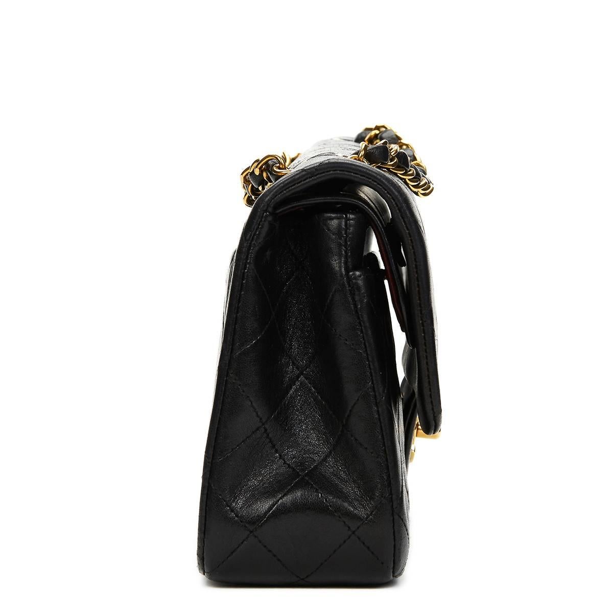 CHANEL
Black Quilted Lambskin Vintage Small Classic Double Flap Bag

This CHANEL Small Classic Double Flap Bag is in Good Pre-Owned Condition. Circa 1991. Primarily made from Lambskin Leather complimented by Gold hardware. Our  reference is HB745