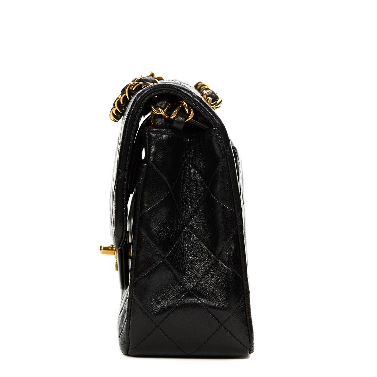 CHANEL
Black Quilted Lambskin Vintage Small Classic Double Flap Bag

This CHANEL Small Classic Double Flap Bag is in Very Good Pre-Owned Condition accompanied by Authenticity Card. Circa 1995. Primarily made from Lambskin Leather complimented by