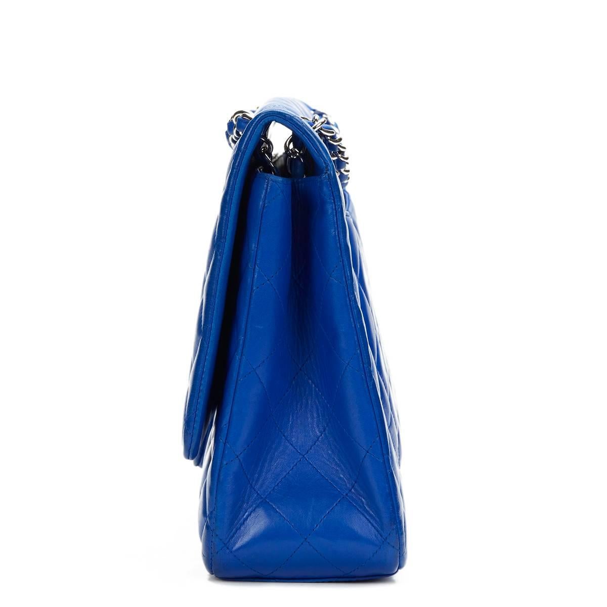 CHANEL
Electric Blue Maxi Classic Single Flap Bag

This CHANEL Classic Single Flap Bag is in Very Good Pre-Owned Condition accompanied by Chanel Dust Bag, Authenticity Card. Circa 2009. Primarily made from Lambskin Leather complimented by Silver