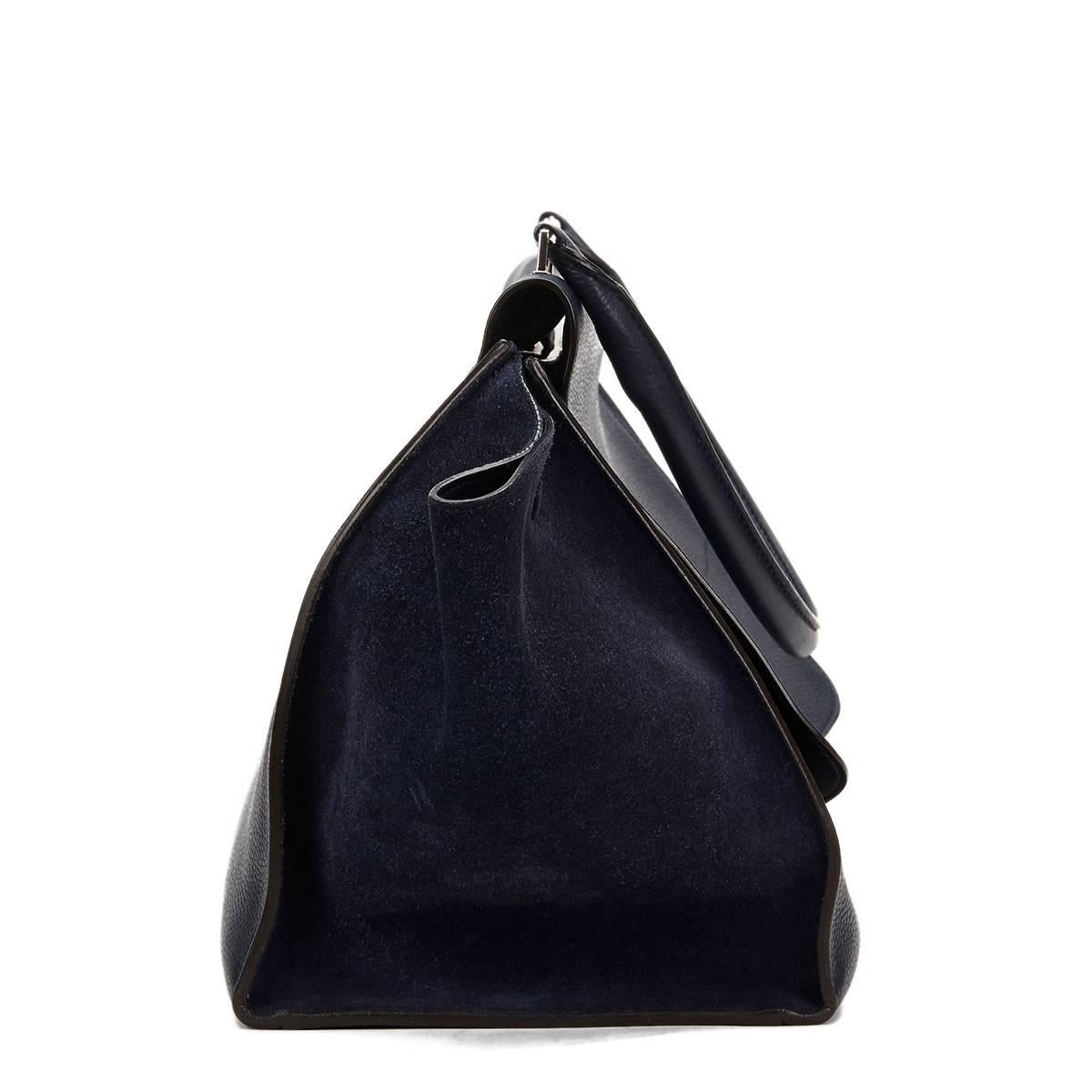 CÉLINE
Navy Drummed Calfskin Leather & Suede Large Trapeze

Reference: HB792
Serial Number: F-CU-0162
Age (Circa): 2012
Authenticity Details: Serial Tag (Made in Italy)
Gender: Ladies
Type: Shoulder, Top Handle

Colour: Navy
Hardware: