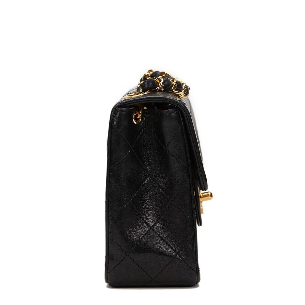 CHANEL
Black Quilted Lambskin Vintage Mini Flap Bag

This CHANEL Mini Flap Bag is in Excellent Pre-Owned Condition accompanied by Chanel Dust Bag. Circa 1987. Primarily made from Lambskin Leather complimented by Gold hardware. Our  reference is
