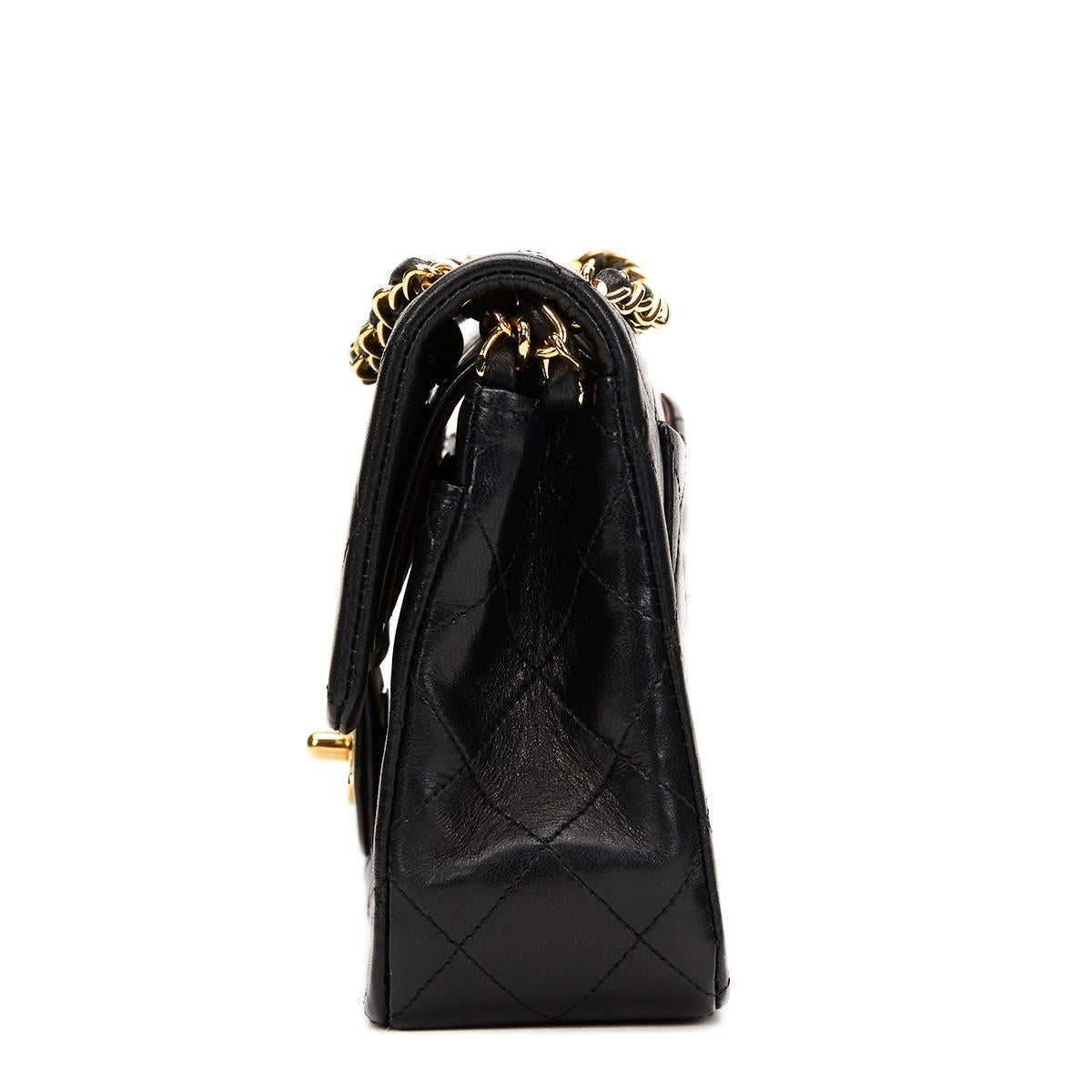 CHANEL
Black Quilted Lambskin Vintage Small Classic Double Flap Bag

This CHANEL Small Classic Double Flap Bag is in Excellent Pre-Owned Condition. Circa 1990. Primarily made from Lambskin Leather complimented by Gold hardware. Our  reference is