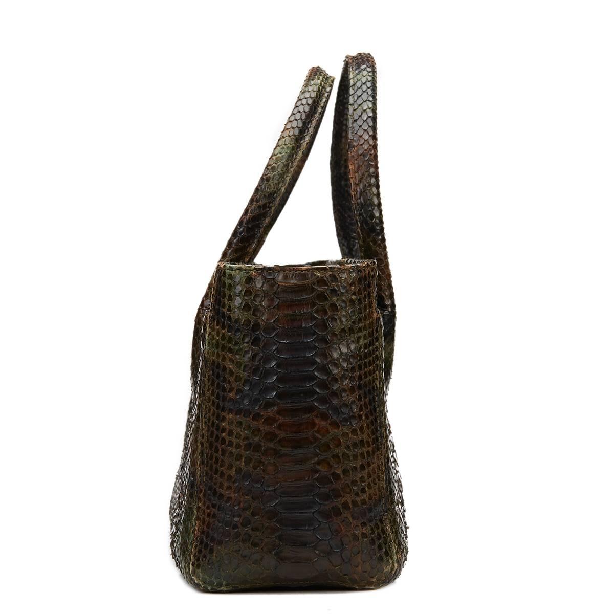CHANEL
Green & Brown Python Cerf Tote

This CHANEL Cerf Tote is in Excellent Pre-Owned Condition accompanied by Chanel Dust Bag, Interior Pouch. Circa 2006. Primarily made from Python complimented by Antiqued Silver hardware. Our  reference is HB850