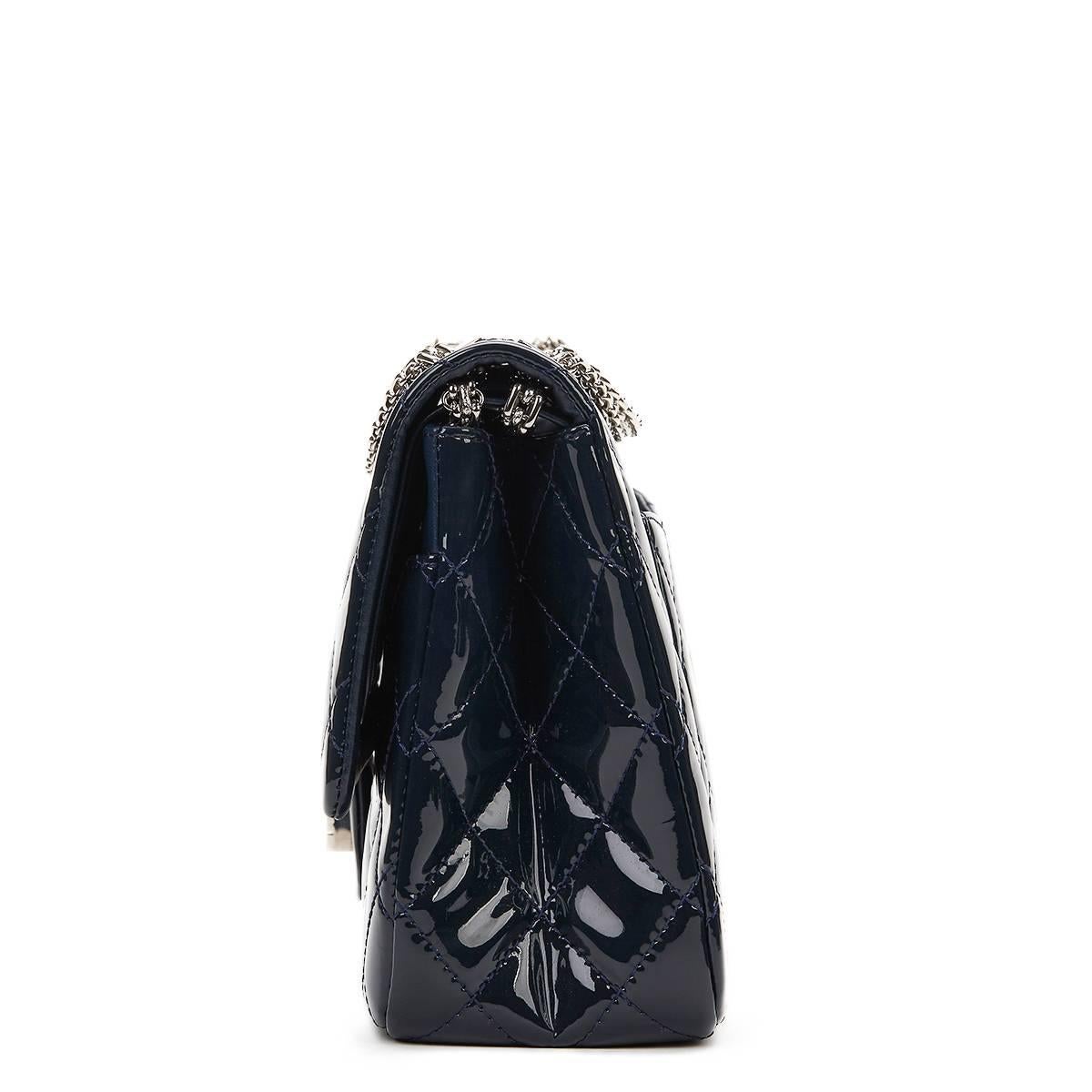 CHANEL
Navy Quilted Patent Leather 2.55 Reissue 227 Double Flap Bag

This CHANEL 2.55 Reissue 227 Double Flap Bag is in Excellent Pre-Owned Condition accompanied by Chanel Dust Bag, Care Cards, Authenticity Card. Circa 2010. Primarily made from