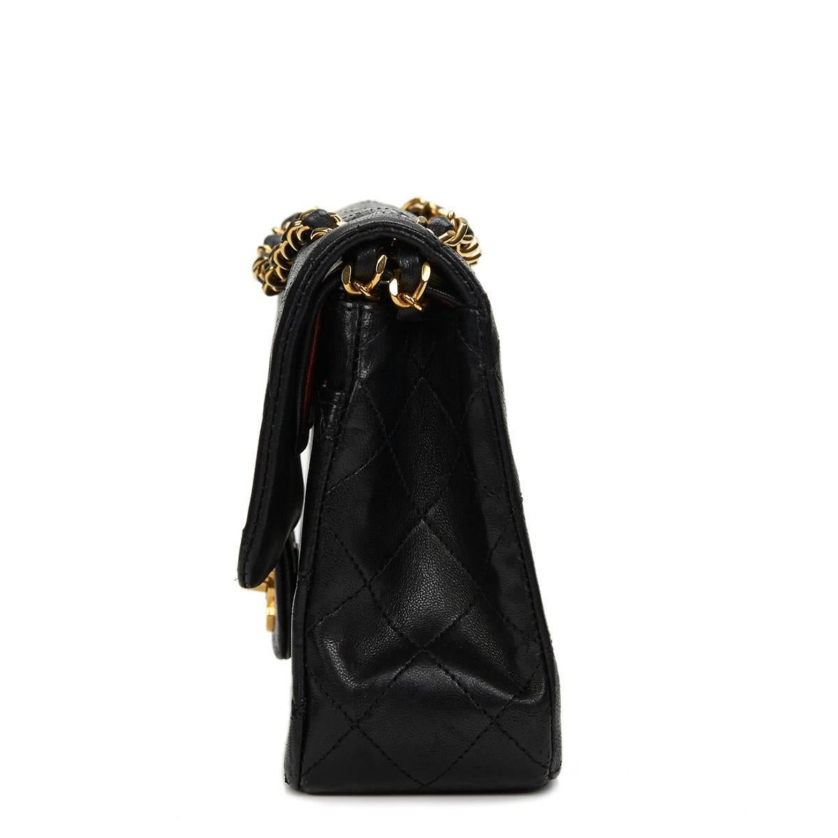 CHANEL
Black Quilted Lambskin Vintage Small Classic Double Flap Bag

This CHANEL Small Classic Double Flap Bag is in Very Good Pre-Owned Condition accompanied by Chanel Dust Bag, Authenticity Card. Circa 1988. Primarily made from Lambskin Leather