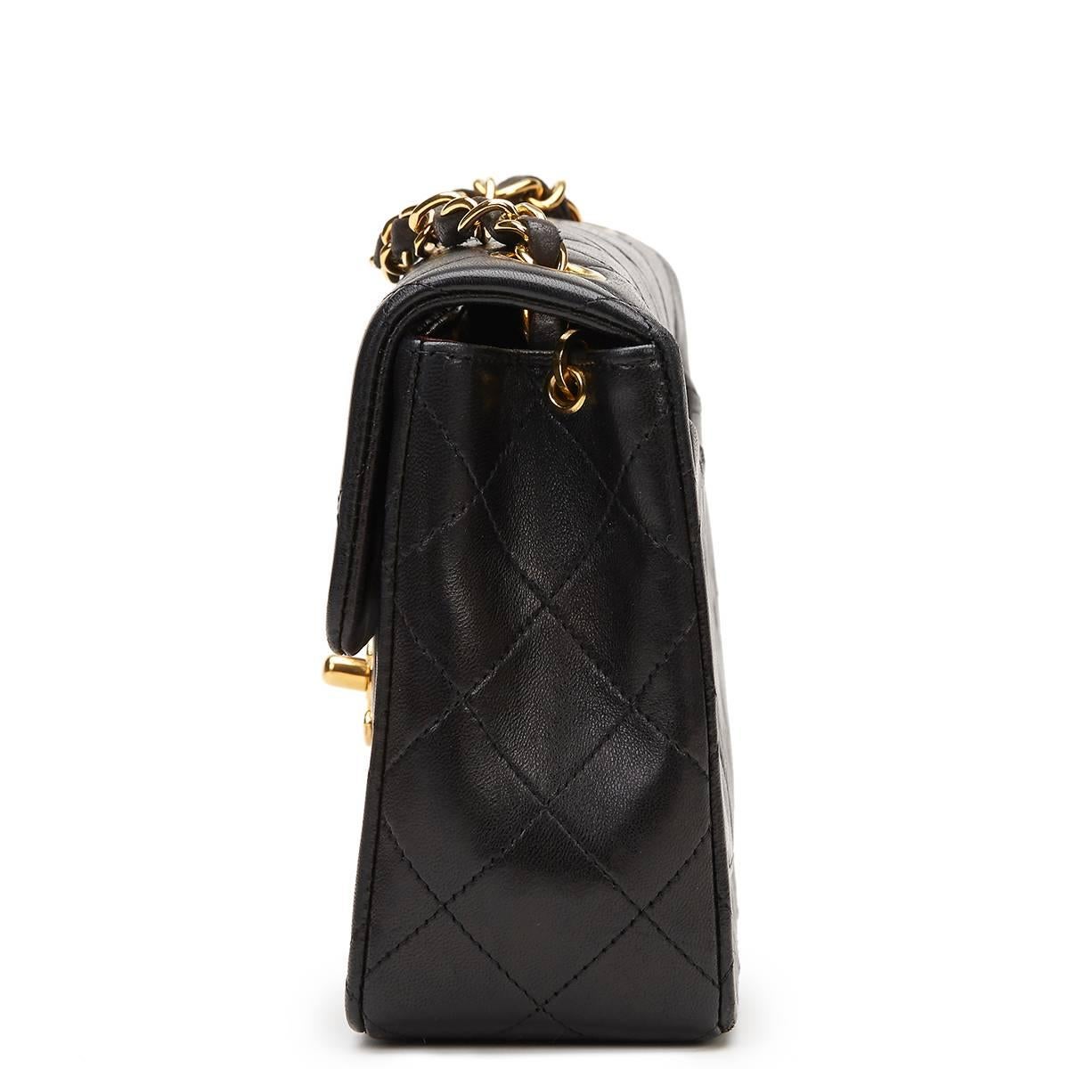 CHANEL
Black Quilted Lambskin Vintage Mini Flap Bag

This CHANEL Mini Flap Bag is in Excellent Pre-Owned Condition accompanied by Chanel Dust Bag, Box, Authenticity Card. Circa 1994. Primarily made from Lambskin Leather complimented by Gold