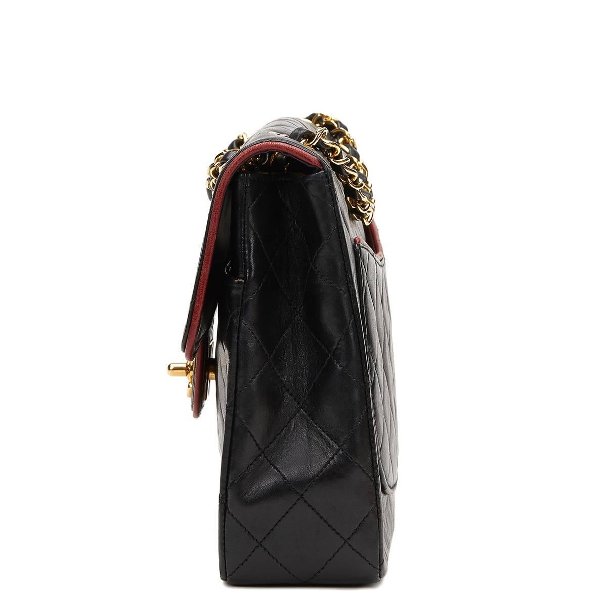 CHANEL
Black Quilted Lambskin Vintage Classic Single Flap Bag

This CHANEL Classic Single Flap Bag is in Excellent Pre-Owned Condition accompanied by Chanel Dust Bag, Box, Authenticity Card. Circa 1987. Primarily made from Lambskin Leather