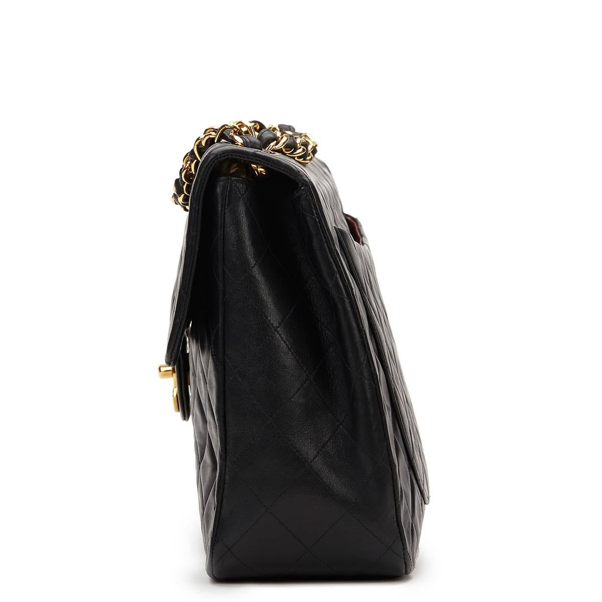 CHANEL
Black Quilted Lambskin Vintage Maxi Jumbo XL Flap Bag

This CHANEL Maxi Jumbo XL Flap Bag is in Excellent Pre-Owned Condition accompanied by Chanel Dust Bag. Circa 1994. Primarily made from Lambskin Leather complimented by Gold hardware. Our 