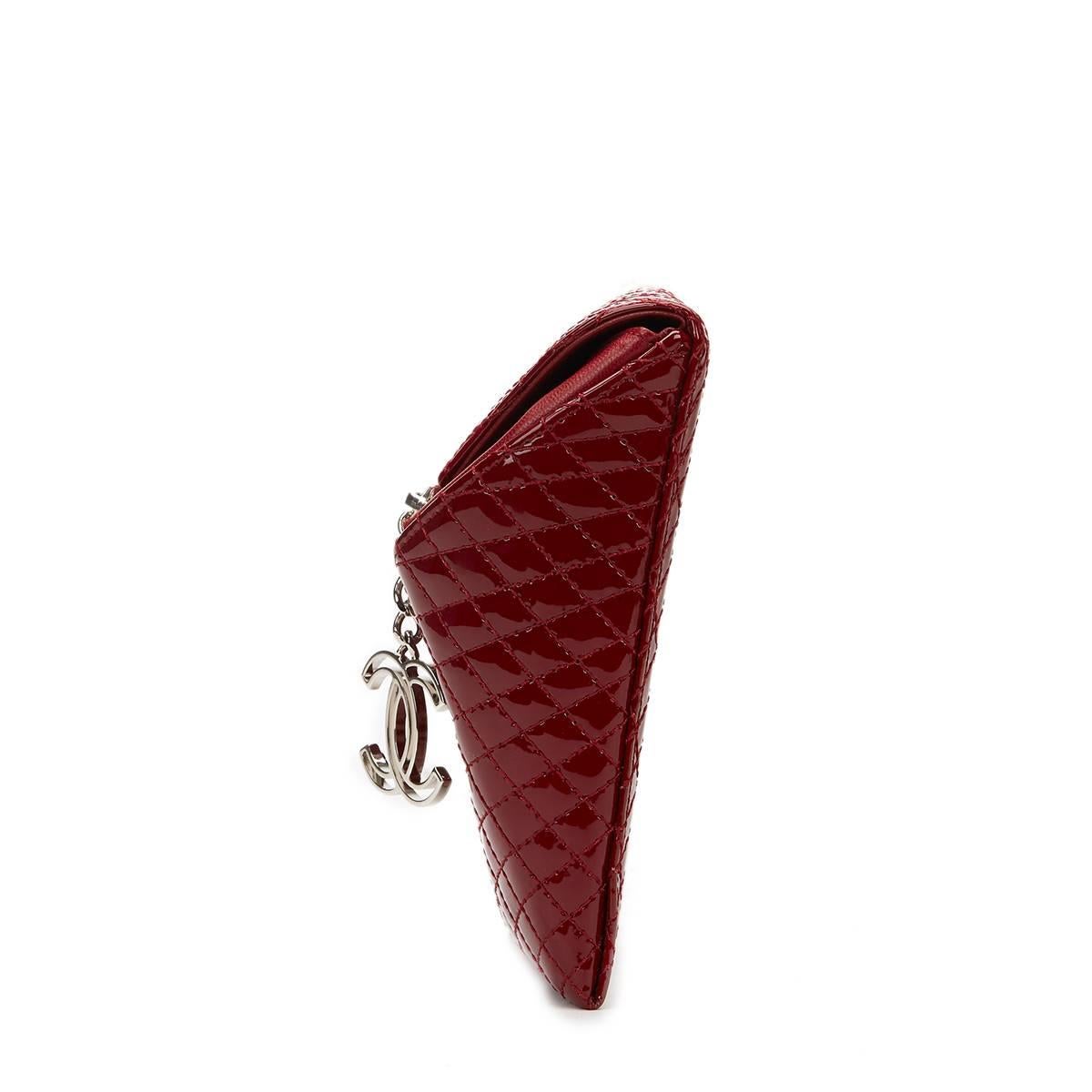 CHANEL
Burgundy Quilted Patent Leather Geometric Clutch

This CHANEL Geometric Clutch is in Excellent Pre-Owned Condition accompanied by Chanel Dust Bag. Circa 2009. Primarily made from Patent Leather complimented by Silver hardware. Our  reference