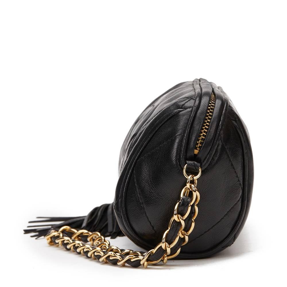 CHANEL
Black Quilted Lambskin Vintage Fringe Pouch

This CHANEL Fringe Pouch is in Excellent Pre-Owned Condition. Circa 1988. Primarily made from Lambskin Leather complimented by Gold hardware. Our  reference is HB980 should you need to quote