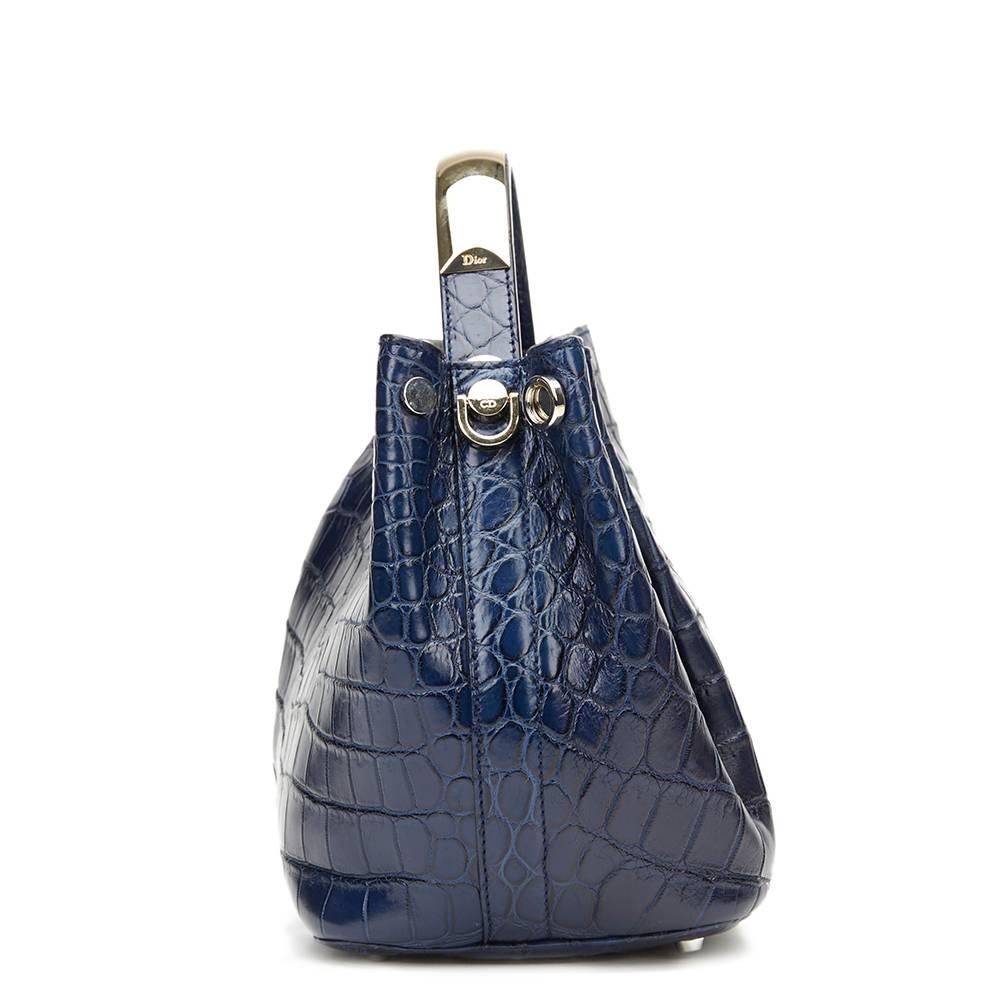 CHRISTIAN DIOR
Marine Crocodile Leather Small Diorific Bucket Bag

This CHRISTIAN DIOR Small Diorific Bucket Bag is in Excellent Pre-Owned Condition accompanied by Authenticity Card, Care Card, Dior Charm & Clochette, Shoulder Strap. Circa 2014.