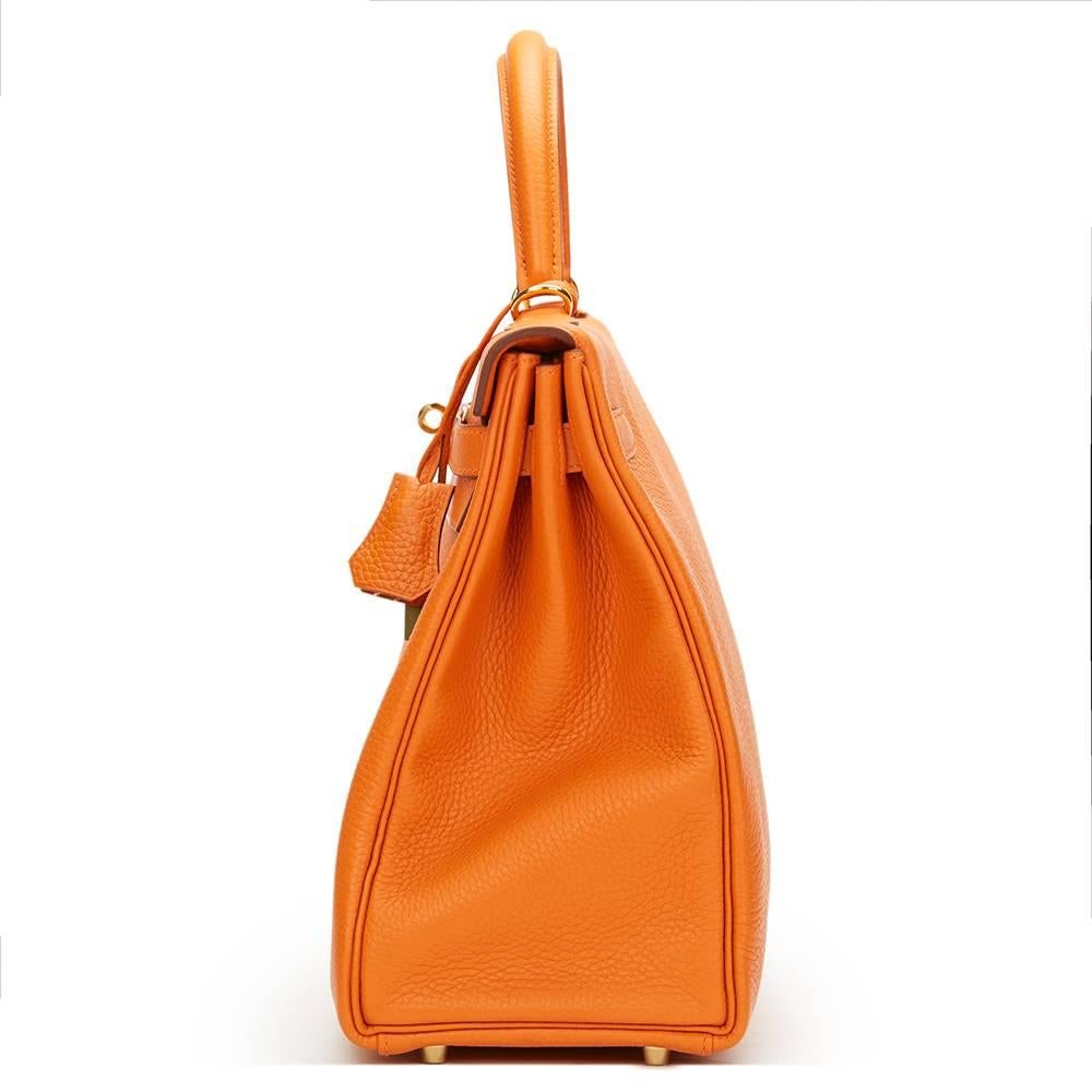 HERMÈS
Orange Clemence Leather Kelly 35cm Retourne

This HERMÈS Kelly 35cm is in Unworn Condition accompanied by Hermes Dust Bag, Box, Lock, Keys, Clochette, Care Card, Rain Cover, Harrods 2017 Receipt. Circa 2016. Primarily made from Clemence