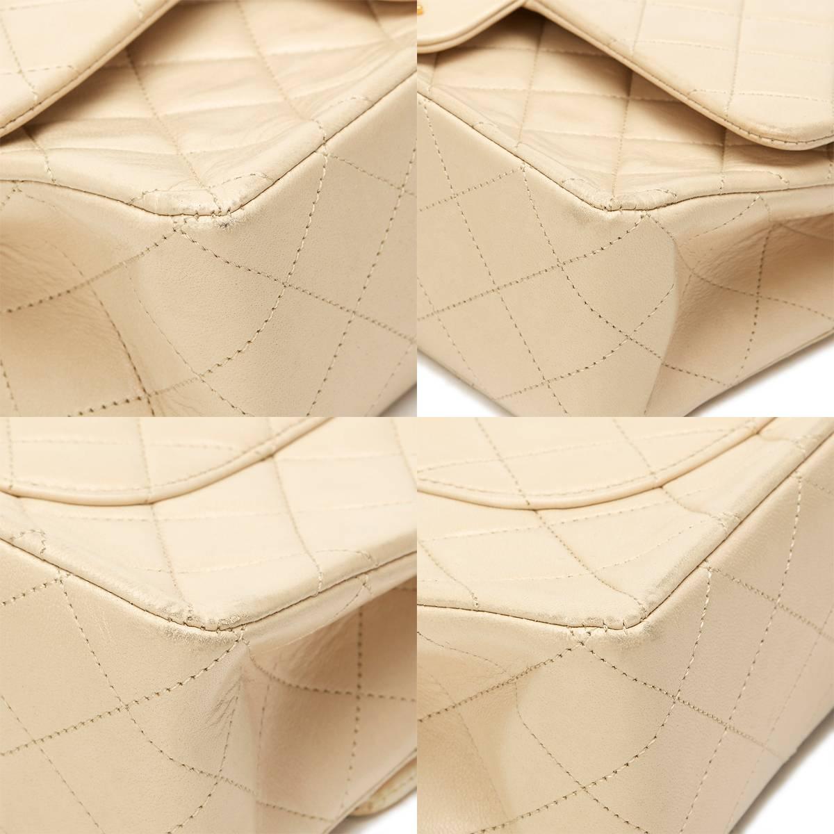 CHANEL
Ivory Quilted Lambskin Vintage Medium Classic Double Flap Bag

 Reference: HB812
Serial Number: 2050763
Age (Circa): 1991
Accompanied By: Chanel Dust Bag, Authenticity Card
Authenticity Details: Authenticity Card, Serial Sticker (Made in