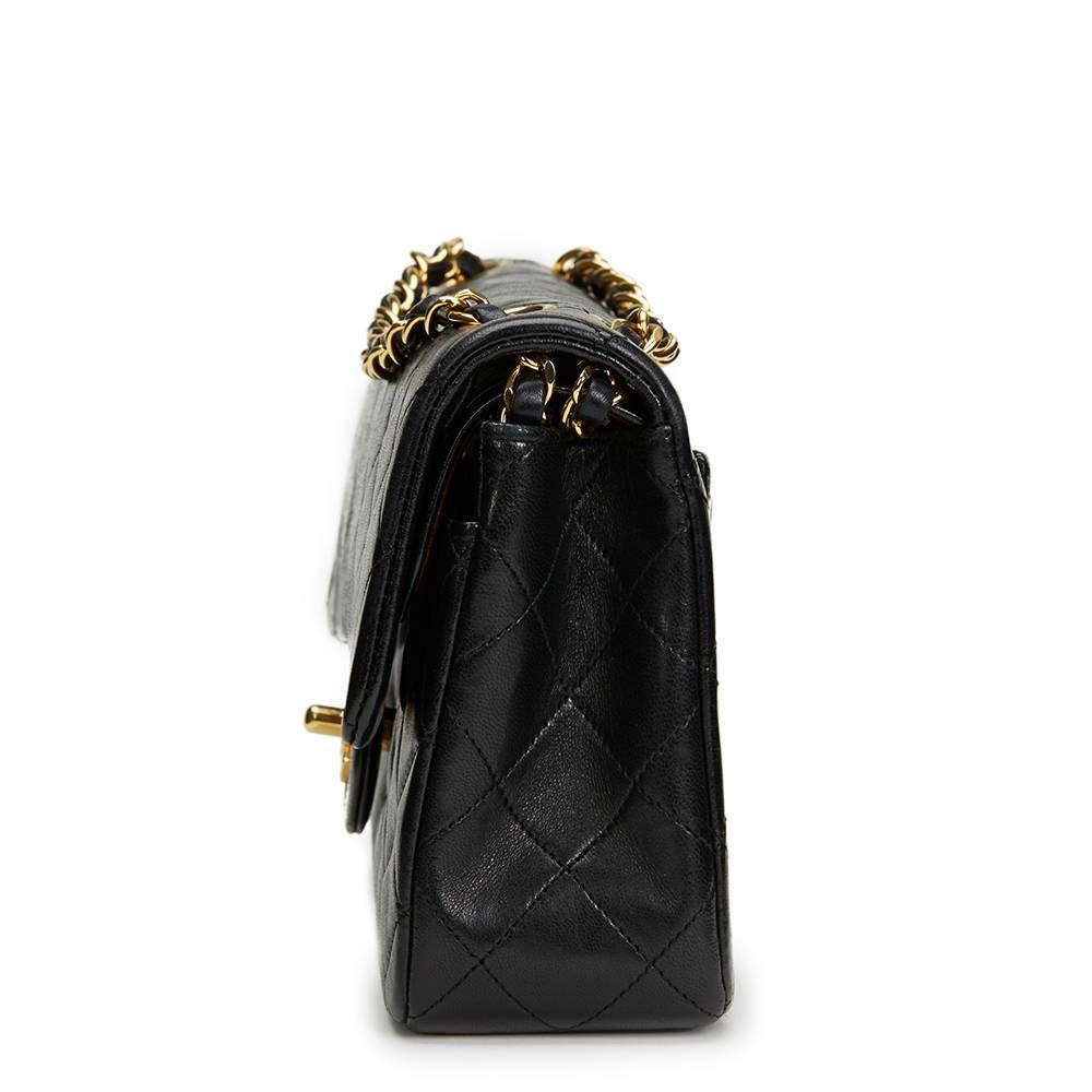 CHANEL
Black Quilted Lambskin Vintage Small Classic Double Flap Bag

This CHANEL Small Classic Double Flap Bag is in Excellent Pre-Owned Condition accompanied by Chanel Dust Bag, Box, Authenticity Card. Circa 1990. Primarily made from Lambskin