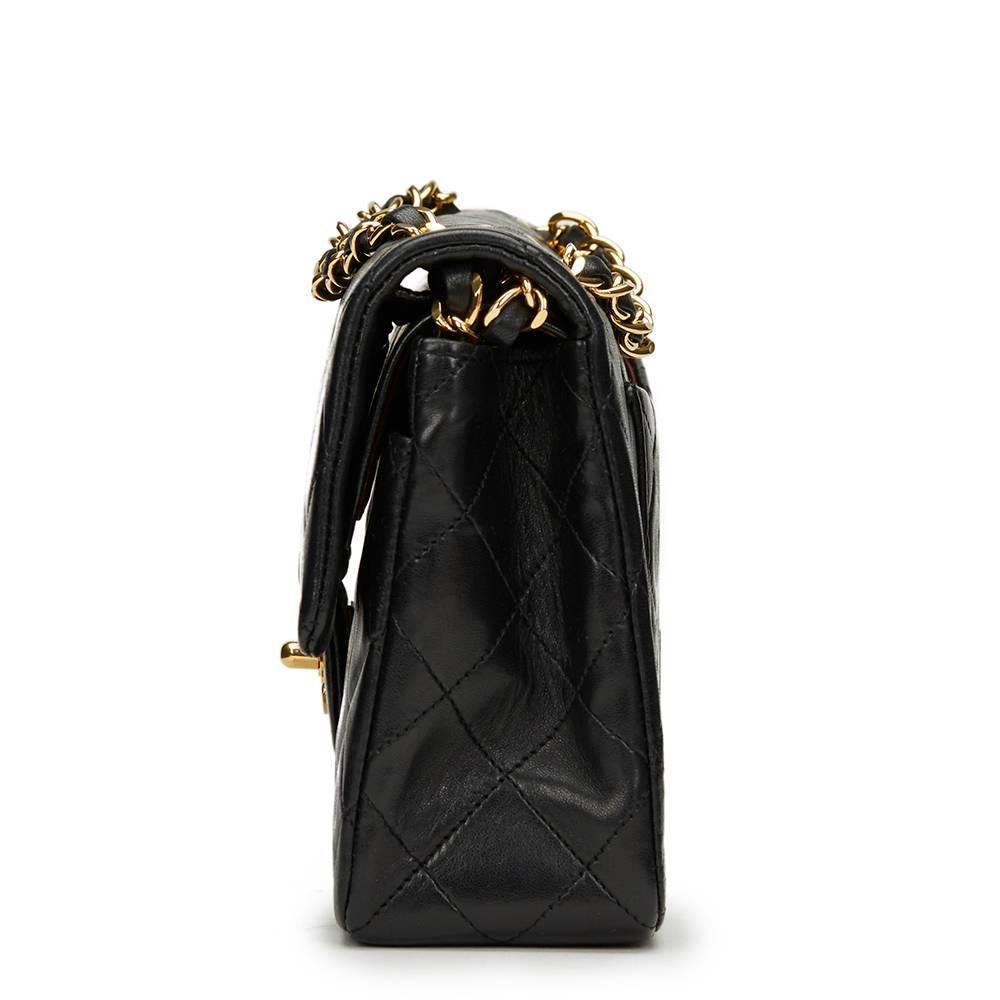 CHANEL
Black Quilted Lambskin Vintage Small Classic Double Flap Bag

This CHANEL Small Classic Double Flap Bag is in Excellent Pre-Owned Condition accompanied by Chanel Dust Bag, Box, Authenticity Card. Circa 1990. Primarily made from Lambskin