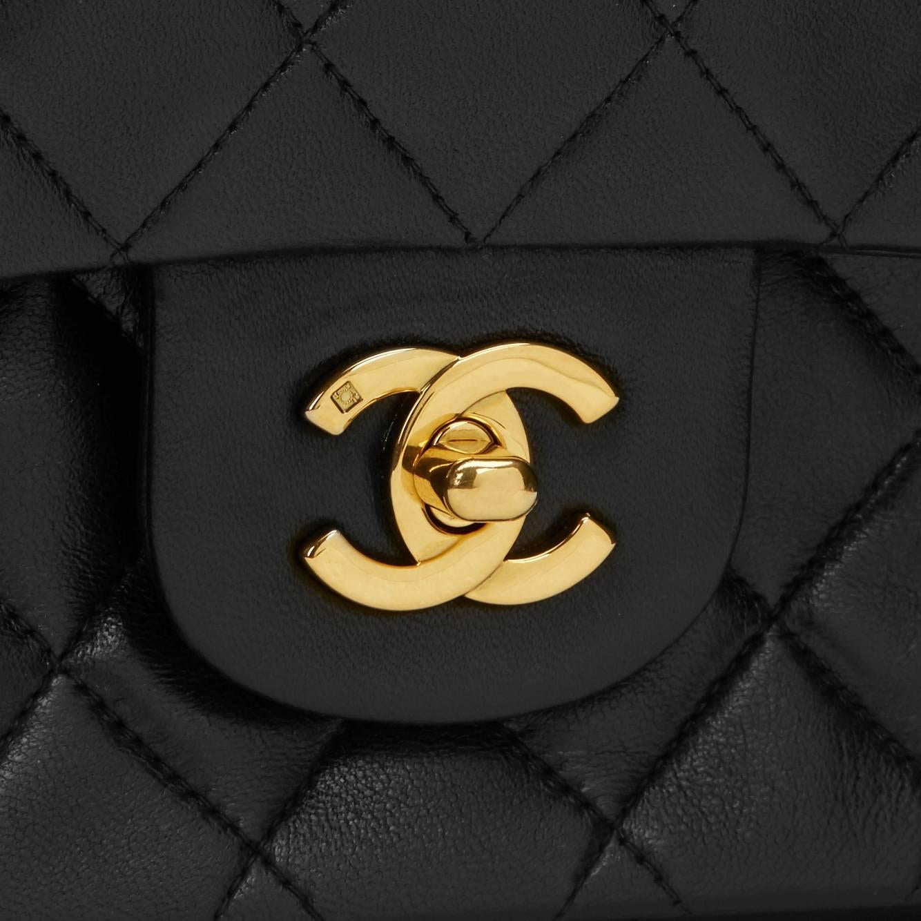 CHANEL
Black Quilted Lambskin Vintage Medium Classic Double Flap Bag

This CHANEL Medium Classic Double Flap Bag is in Excellent Pre-Owned Condition accompanied by Chanel Dust Bag, Box, Authenticity Card. Circa 1992. Primarily made from Lambskin