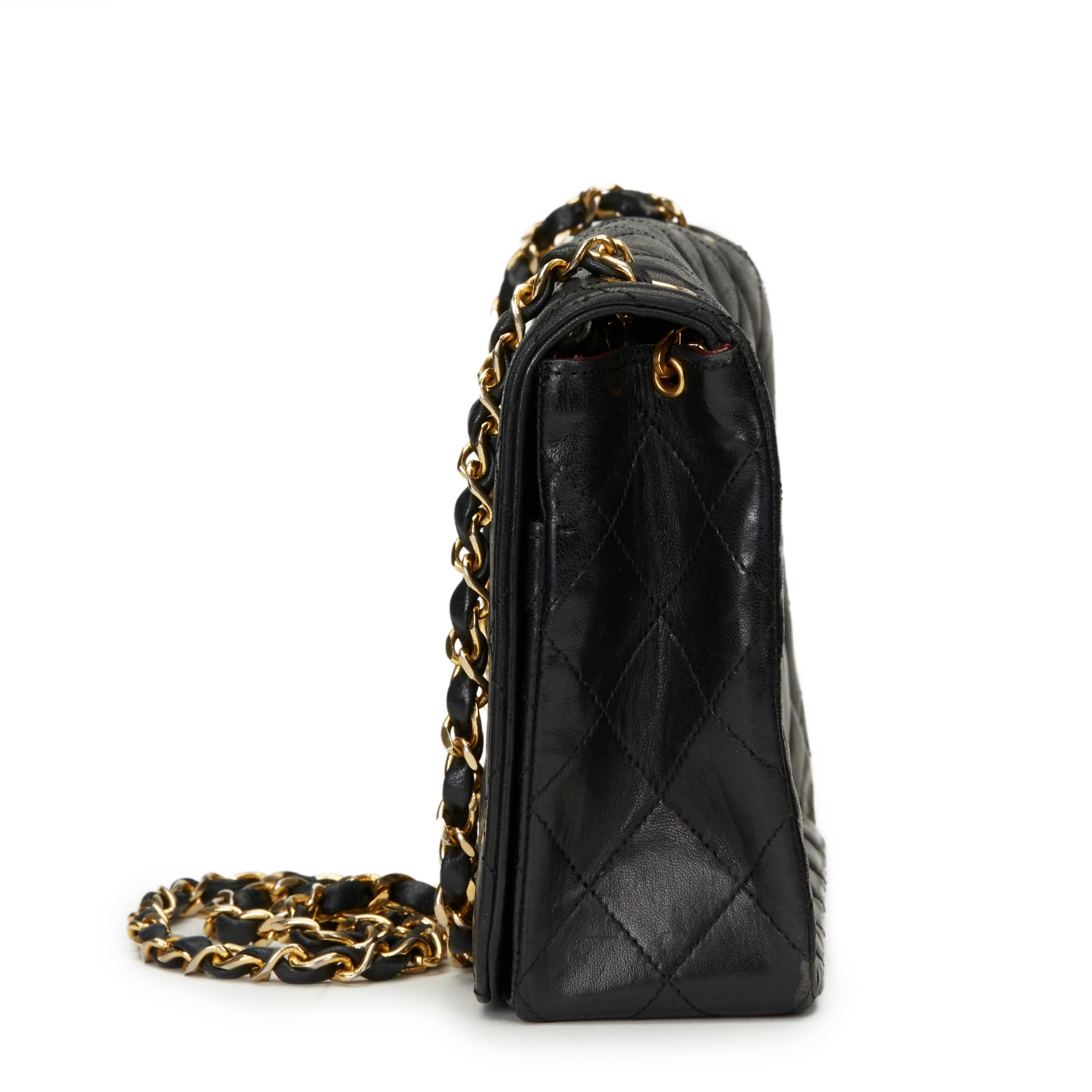 CHANEL
Black Quilted Lambskin Vintage Classic Single Flap Bag

This CHANEL Classic Single Flap Bag is in Very Good Pre-Owned Condition. Circa 1989. Primarily made from Lambskin Leather complimented by Gold hardware. Our  reference is HB1103 should