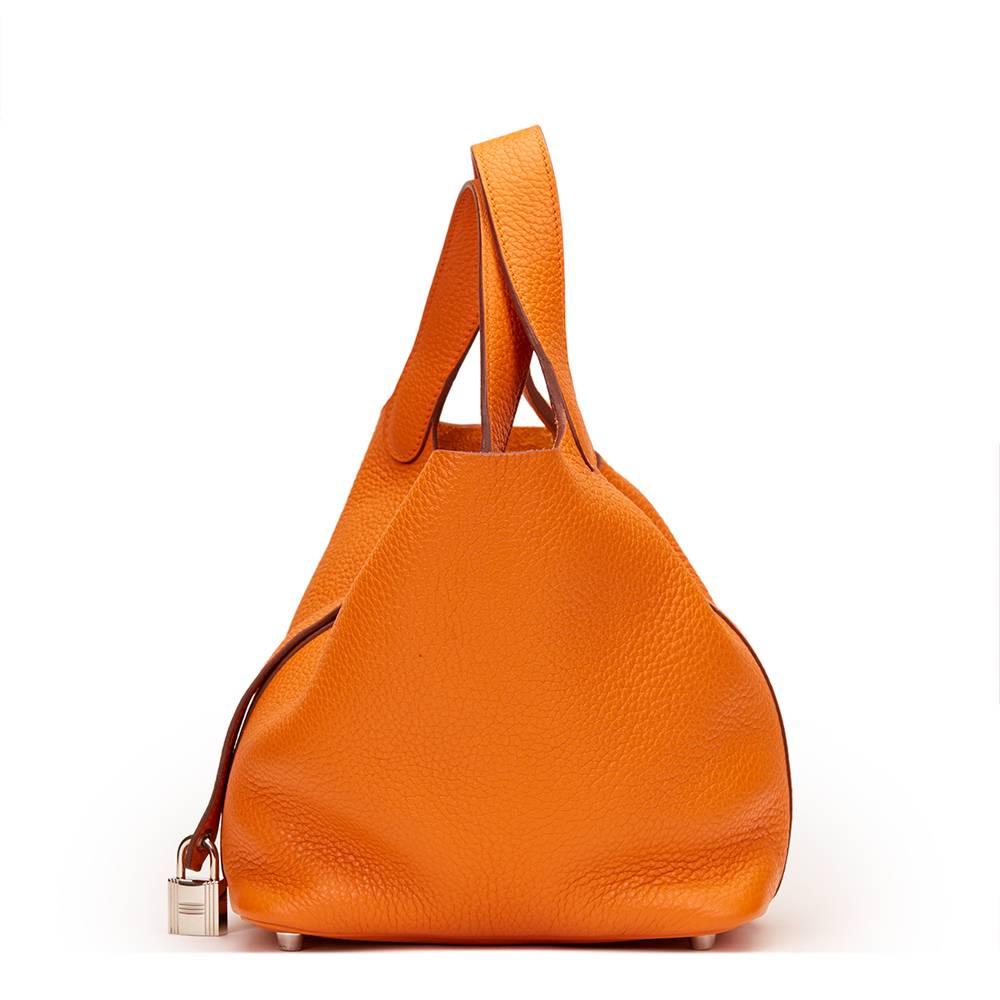 HERMÈS
Orange Clemence Leather Picotin PM

This HERMÈS Picotin Lock PM is in Excellent Pre-Owned Condition accompanied by Hermes Dust Bag, Box, Lock, Keys. Circa 2012. Primarily made from Clemence Leather complimented by Palladium hardware. Our 