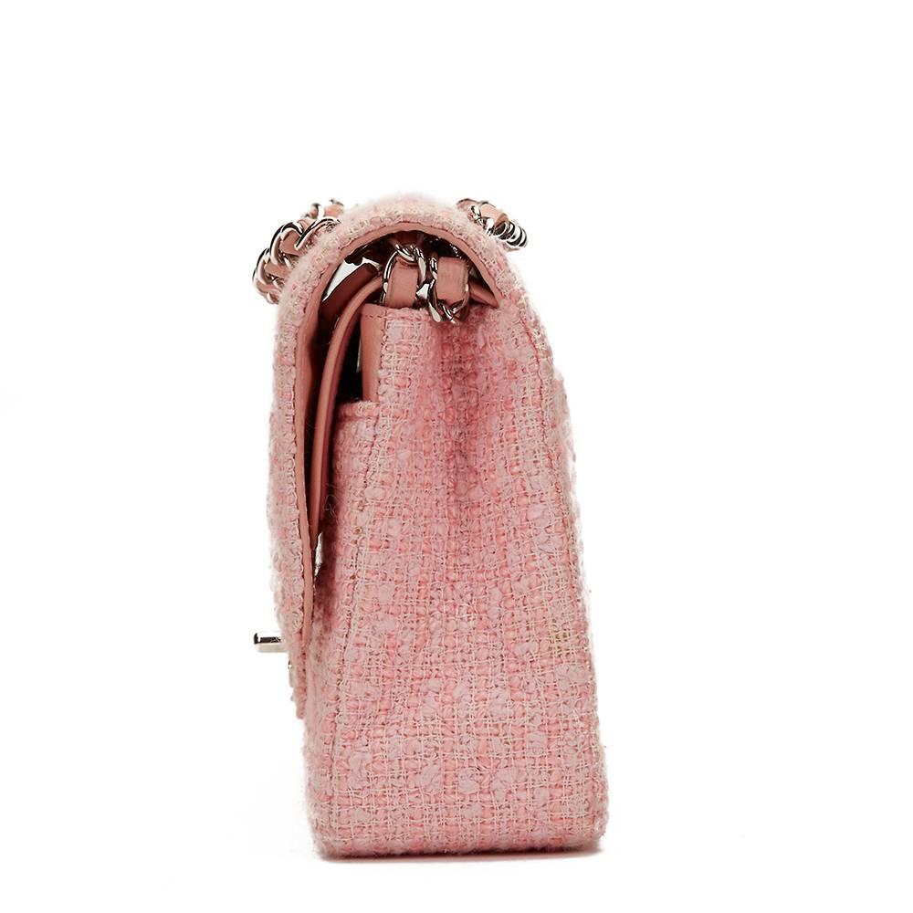 CHANEL
Pink Quilted Tweed Medium Classic Double Flap Bag

This CHANEL Medium Classic Double Flap Bag is in Very Good Pre-Owned Condition accompanied by Chanel Dust Bag, Box. Circa 2003. Primarily made from Tweed complimented by Silver hardware. Our 