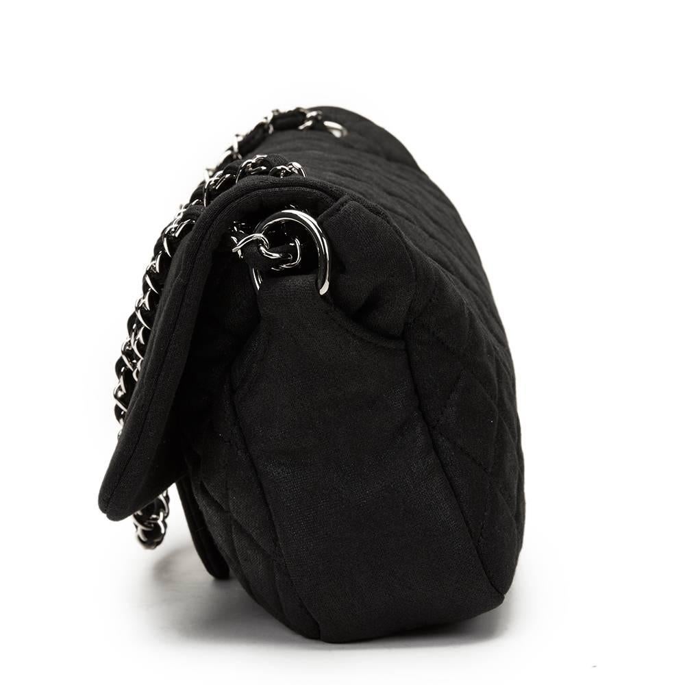 CHANEL
Black Quilted Jersey Fabric Single Flap Bag

This CHANEL Single Flap Bag is in Excellent Pre-Owned Condition. Circa 2009. Primarily made from Jersey Fabric complimented by Silver hardware. Our  reference is HB1156 should you need to quote