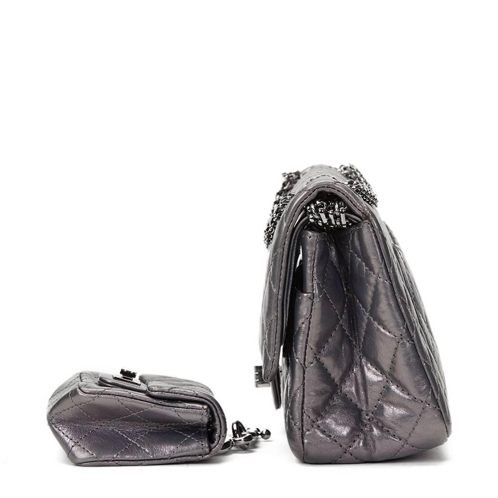 CHANEL
Dark Silver Aged Calfskin 2.55 Reissue 225 Double Flap Bag with Charm

This CHANEL 2.55 Reissue 225 Double Flap Bag is in Excellent Pre-Owned Condition accompanied by Chanel Box, Authenticity Card. Circa 2010. Primarily made from Aged