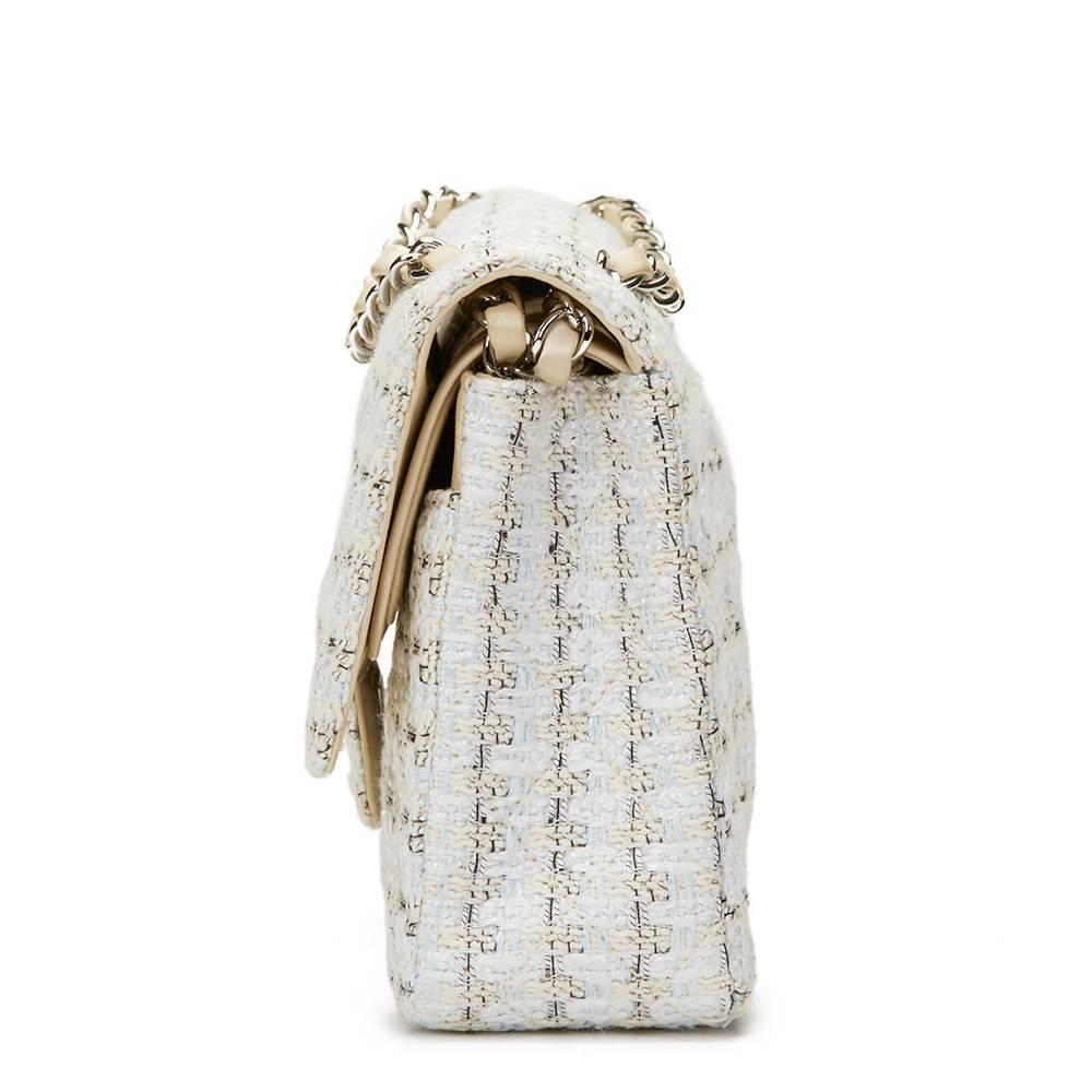 CHANEL
Beige, White, Blue Tweed Medium Classic Double Flap Bag

This CHANEL Medium Classic Double Flap Bag is in Excellent Pre-Owned Condition accompanied by Chanel Dust Bag, Authenticity Card, Care Booklet. Circa 2005. Primarily made from Tweed