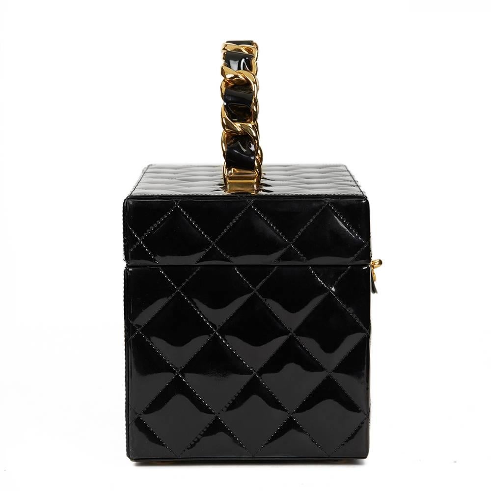 CHANEL
Black Patent Leather Vintage Timeless Vanity Handbag Case

This CHANEL Timeless Vanity Handbag is in Excellent Pre-Owned Condition accompanied by Chanel Dust Bag. Circa 1996. Primarily made from Patent Leather complimented by Gold hardware.